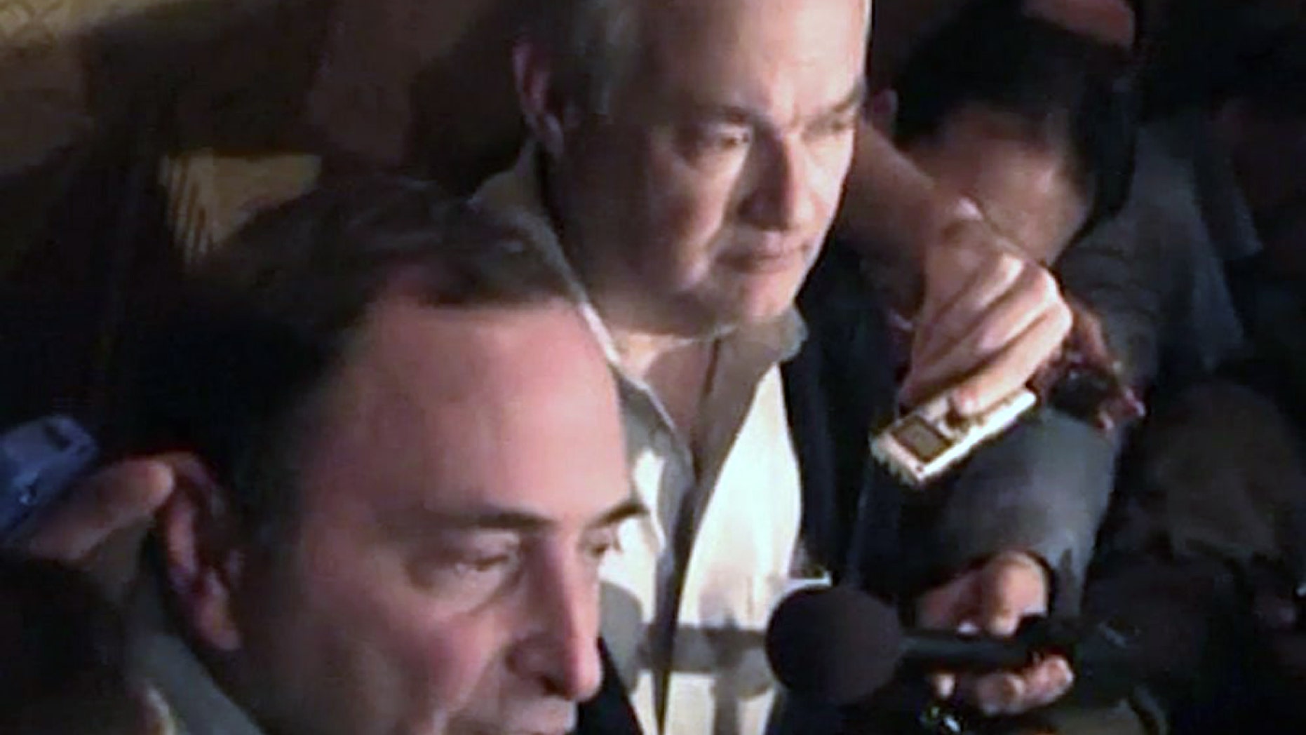 In this image from video, NHL commissioner Gary Bettman, left, talks to the media as Donald Fehr, executive director of the NHL Players' Association, stands next to him, in New York, early Sunday, Jan. 6, 2013. A tentative deal to end the 113-day NHL lockout was reached early Sunday morning following a marathon 16-hour negotiating session. (AP Photo/The Canadian Press, Chris Johnston)