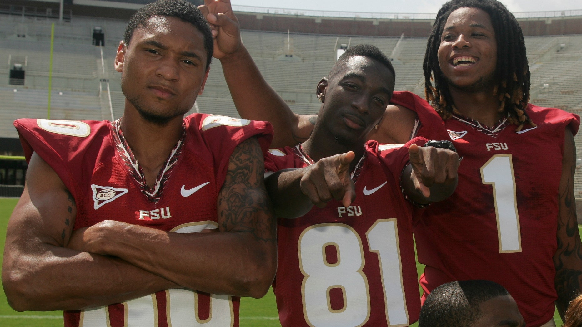 FILE - In this Aug. 12, 2012 file photo, Florida State wide receivers Rashad Greene (80), Kenny Shaw (81) and Kelvin Benjamin (1) have fun during a photo shoot during the Seminoles' football media day in Tallahassee, Fla. No. 3-ranked Florida State has a Heisman Trophy candidate in Jameis Winston, but his receivers corps makes life much easier as one of the top corps in the nation. No. 7 Miami must control the trio of Greene, Shaw and Benjamin to have a chance at an upset. (AP Photo/Phil Sears, File)