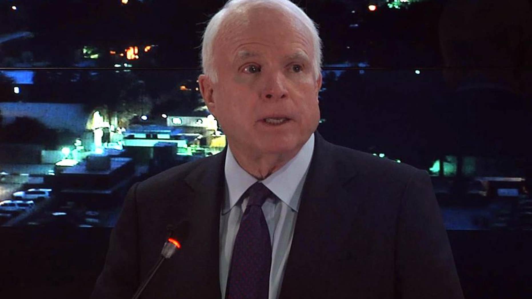 In this video frame grab, Sen. John McCain, R-Ariz. speaks to reporters during a visit to Kabul, Afghanistan, Saturday, July 4, 2015. McCain said that the ongoing Taliban offensive in Afghanistan demands a reassessment of the Obama administration's current plan to drawdown U.S. forces. (AP Photo)