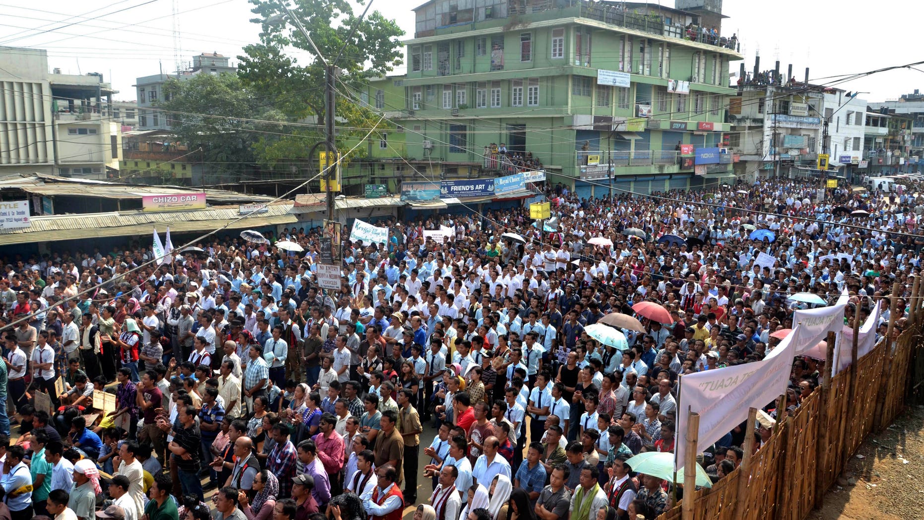 In this Thursday, Oct. 31, 2013 photo, tribal Nagas participate in a protest rally against paying taxes to multiple rebel groups fighting for autonomy and a single Naga homeland, in Dimapur, in the northeastern Indian state of Nagaland. The protest movement, attended by thousands, marks the first time locals have challenged the illegal tax arrangement that has guaranteed decades of funding to rebel groups. (AP Photo/Caisii Mao)