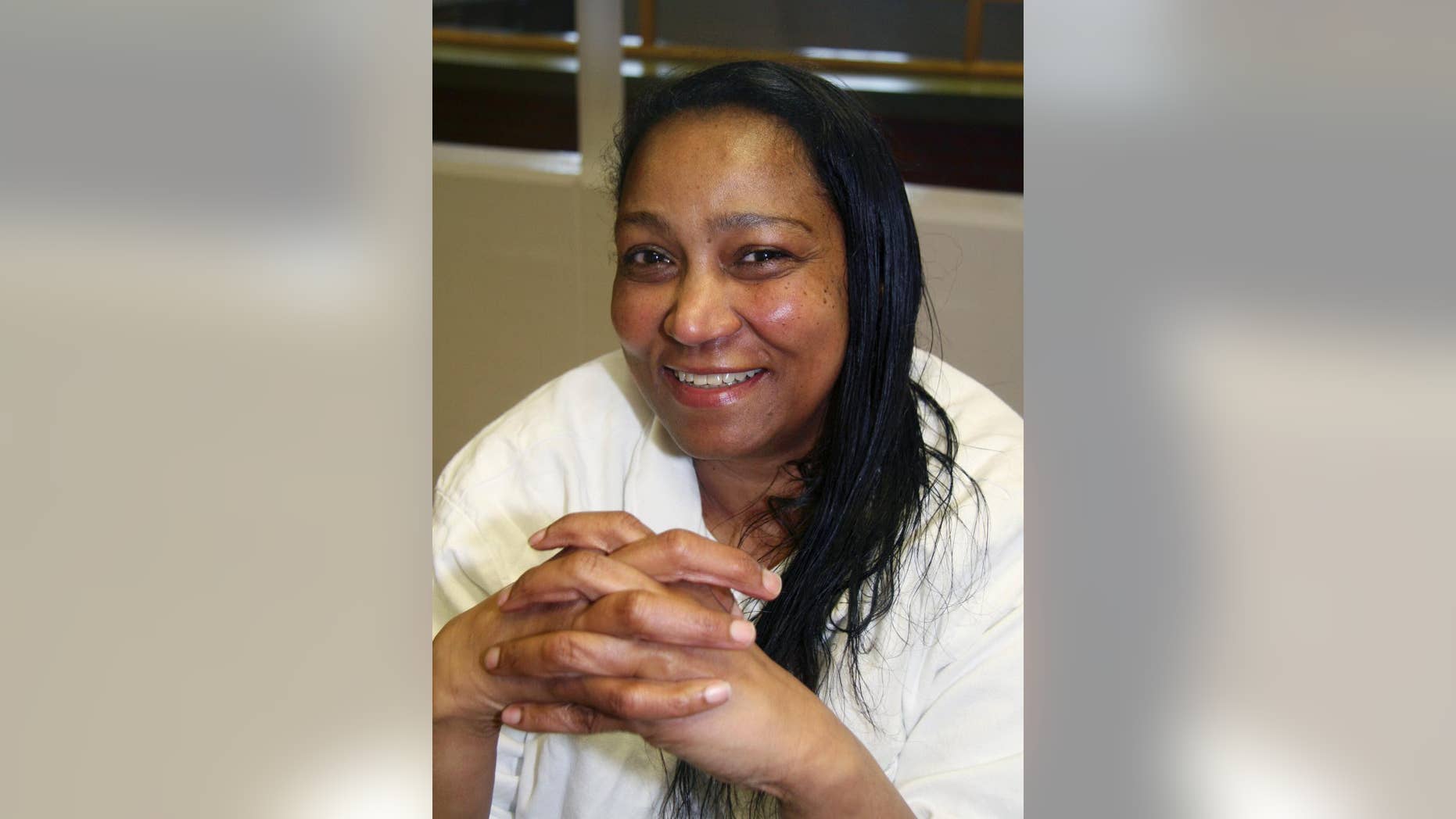 FILE - In this April 13, 2010, file photo, Linda Carty poses for a photo at the Texas Department of Criminal Justice Mountain View Unit outside Gatesville, Texas. A judge on Thursday, Sept. 1, 2016, rejected arguments from attorneys for Carty, a British woman on Texas death row, that prosecutors coerced witnesses and improperly hid information that could have affected the outcome of her murder trial 14 years ago. (AP Photo/Michael Graczyk, File)