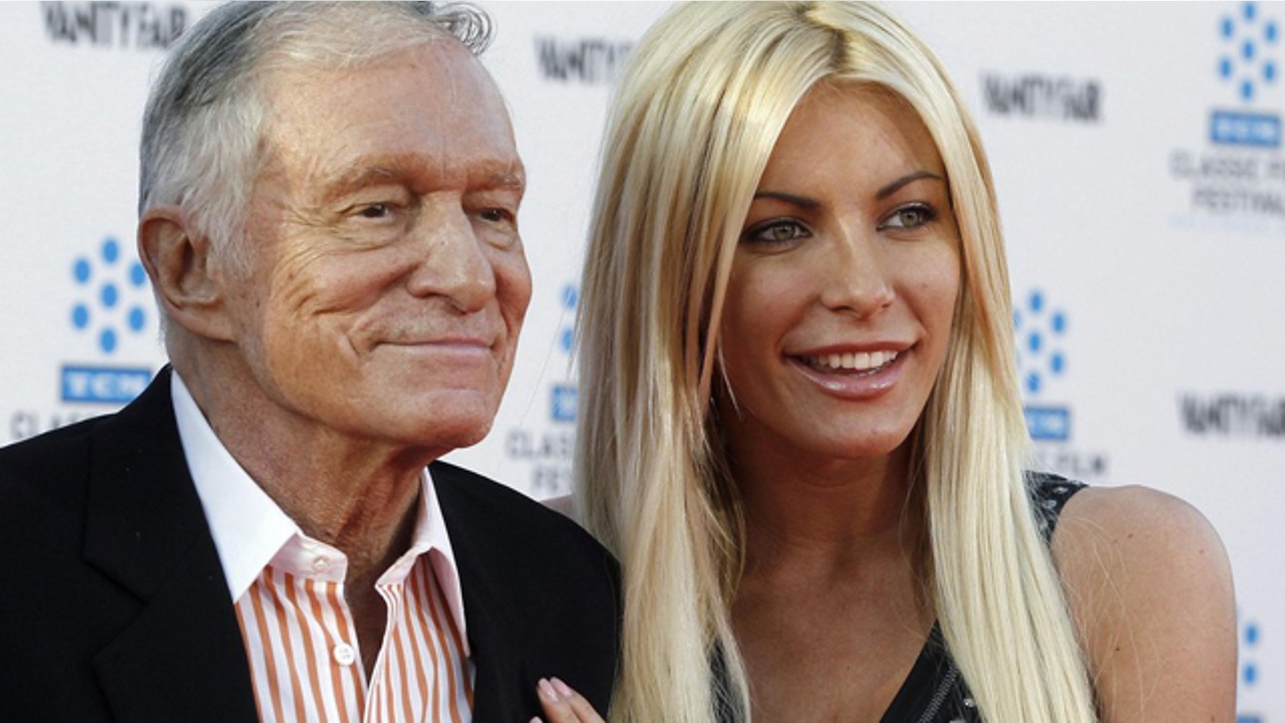 April 28: Playboy Playmate Crystal Harris and her fiance Hugh Hefner arrive at an opening night gala in Hollywood