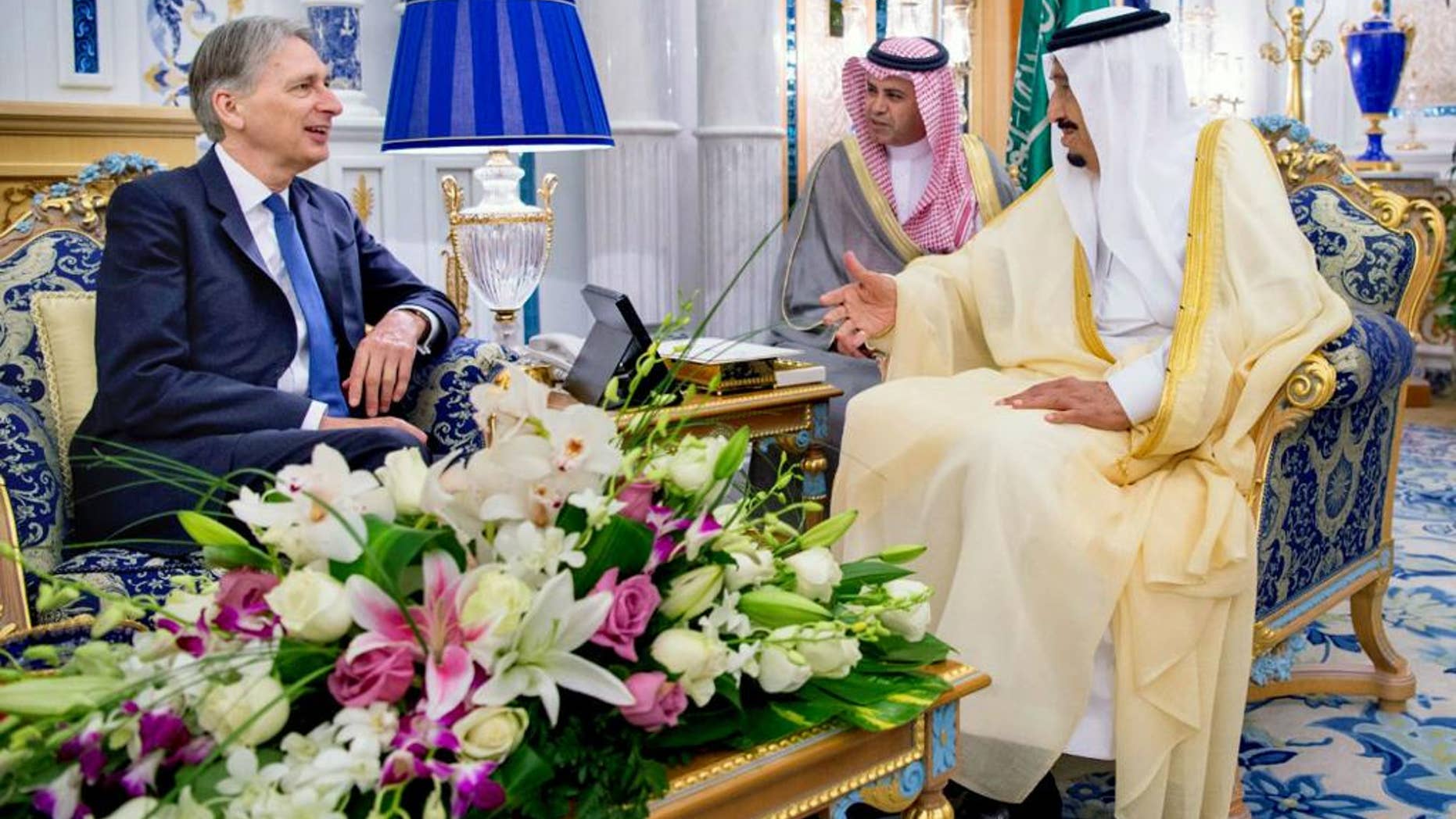 In this Sunday May 29, 2016 photo released by the Saudi Press Agency, SPA, King Salman bin Abdulaziz Al Saud, right, receives British Foreign Secretary Philip Hammond in Jiddah, Saudi Arabia. (Saudi Press Agency via AP)