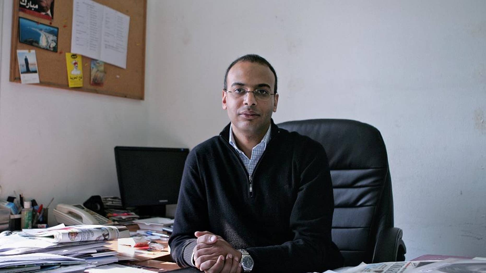 FILE -- This Dec. 7, 2011 photo, shows Hossam Bahgat in his office at the Egyptian Initiative for Personal Rights in Garden City, Cairo, Egypt. An Egyptian court on Saturday, Sept. 17, 2016 upheld a decision to freeze the assets of several prominent human rights campaigners in the latest blow to a once-vibrant activist community that has been largely silenced by a government crackdown. The five activists named in the court ruling include Gamal Eid and Bahey eldin Hassan, who head two well-known human rights organizations, as well as investigative reporter Hossam Bahgat, also the founder of a rights group. The other two are Mustafa el-Hassan and Abdel-Hafiz Tayel. (Sarah Rafea via AP, File) MANDATORY CREDIT