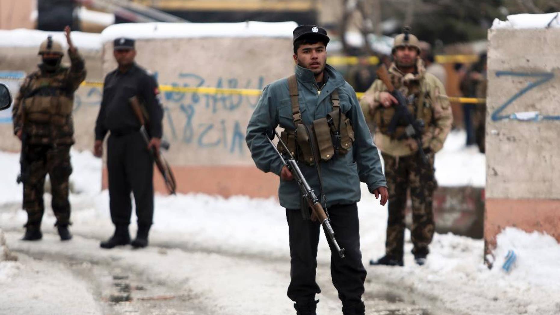 Security personnel stand guard at the site of a suicide attack on the Supreme Court in Kabul, Afghanistan, Tuesday, Feb. 7, 2017. A suicide bomber on Tuesday targeted the Supreme Court building in the Afghan capital, Kabul, killing over a dozen people, officials said. (AP Photo/Rahmat Gul)