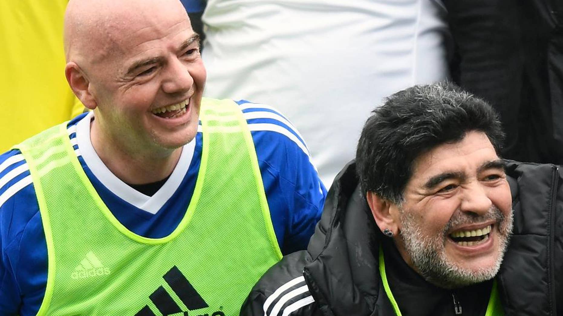 FILE - In this Monday, Jan. 9, 2017 file photo, Argentina's former soccer player Diego Maradona, right, and FIFA President Gianni Infantino share a laugh during a soccer match with FIFA Legends at the home of FIFA in Zurich, Switzerland. FIFA’s peacemaking with Diego Maradona has led to an ambassador’s role for the Argentina great, announced late Thursday Feb. 9, 2017 by Maradona. (Walter Bieri/Keystone via AP, File)