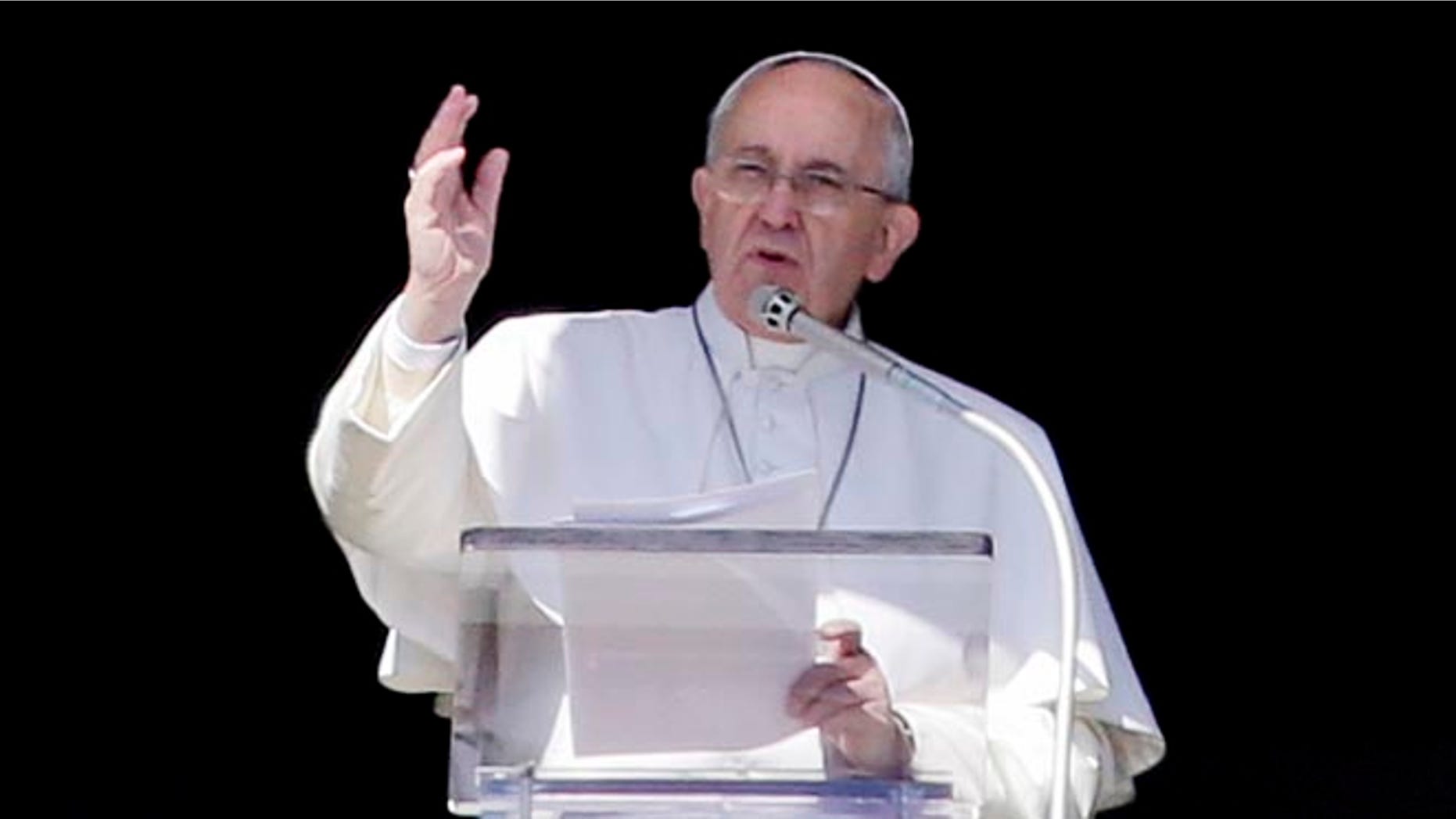 Pope Francis delivers his blessing during the Angelus noon prayer from a window of the Apostolic palace in St. Peter's Square, at the Vatican, Sunday, Feb. 8, 2015. (AP Photo/Gregorio Borgia)