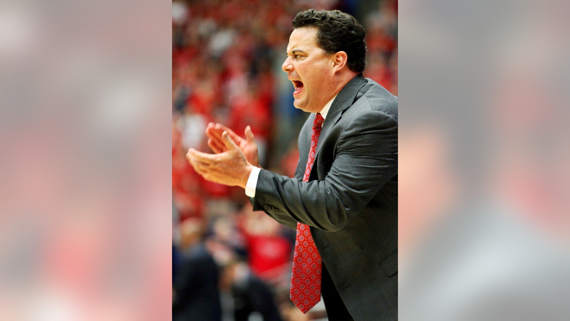 Arizona's head coach Sean Miller encourages his team in the second half against Oregon State of an NCAA college basketball game on Sunday, Feb. 9, 2014, in Tucson, Ariz. Arizona won 76-54. (AP Photo/John MIller)