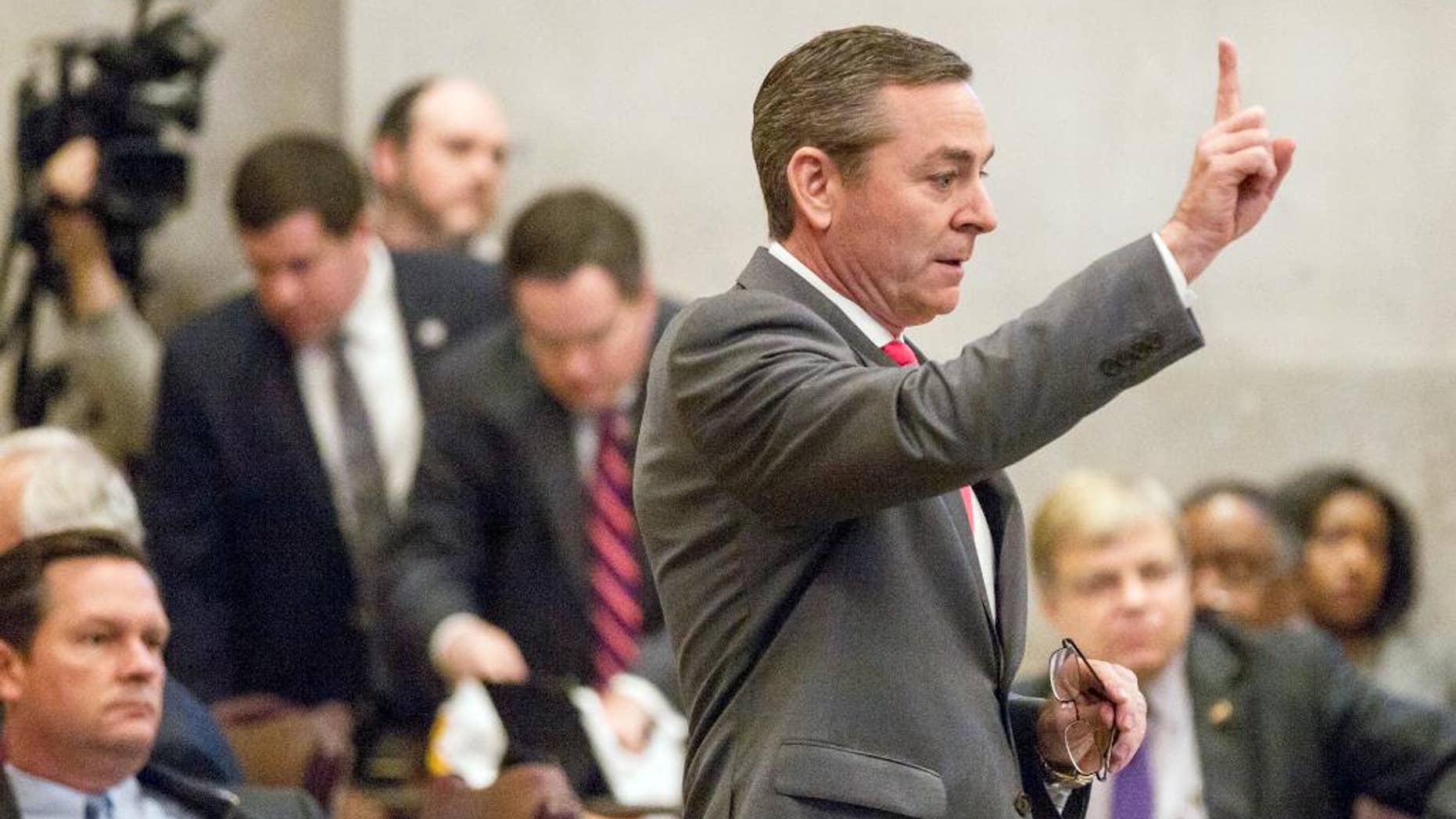 House Republican Caucus Chairman Glen Casada signals to colleagues on the House floor in Nashville, Tenn., Wednesday April 6, 2016, during a debate about a bill to allow counselors to refuse treatment of patients based on personal beliefs. Those opposed to the bill, say the measure casts such a wide net that therapists could virtually turn anyone away. (AP Photo/Erik Schelzig)