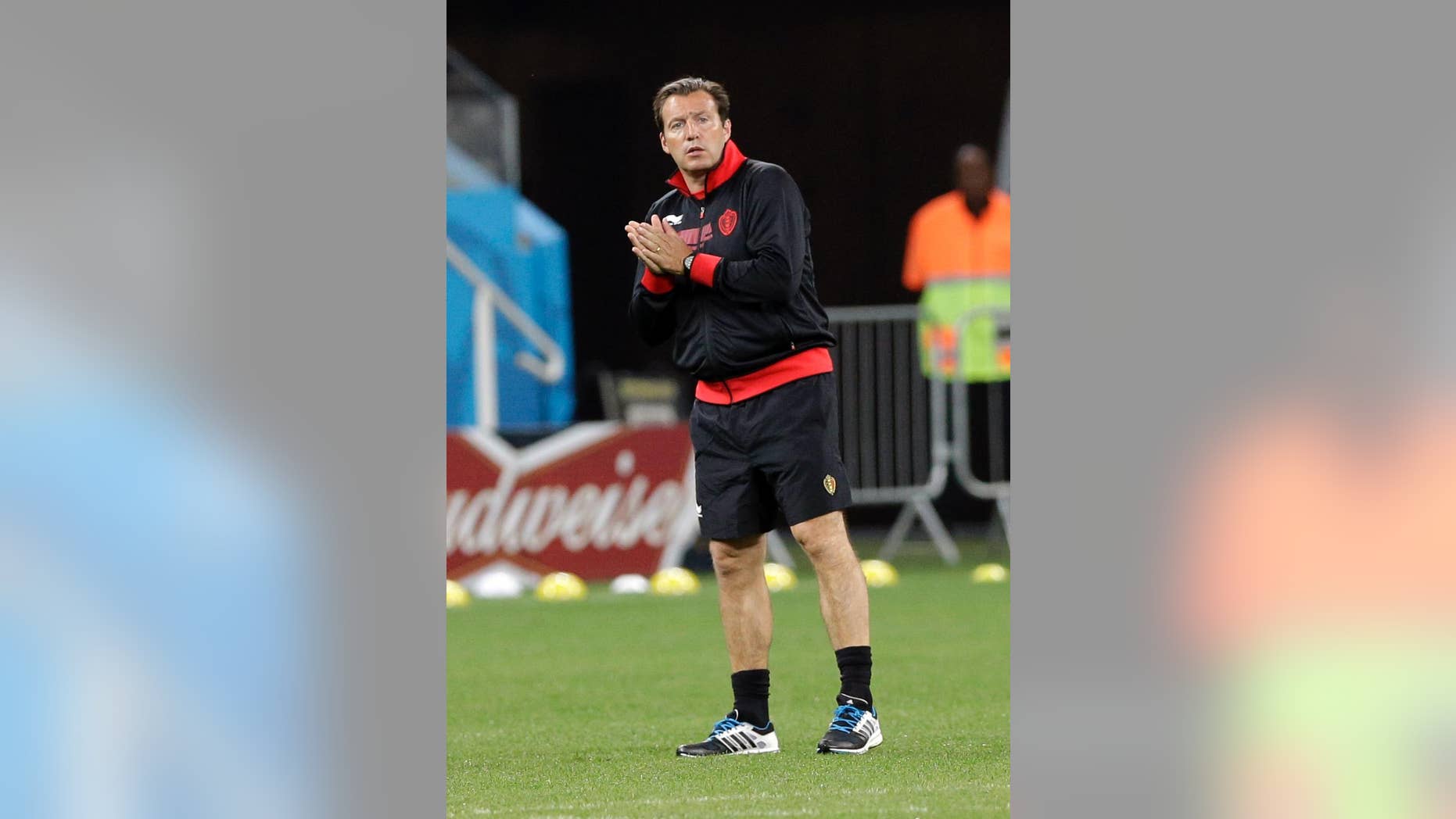 Belgium's head coach Marc Wilmots watches his players during an official training session the day before the group H World Cup soccer match between South Korea and Belgium at the Itaquerao Stadium in Sao Paulo, Brazil, Wednesday, June 25, 2014. (AP Photo/Lee Jin-man)