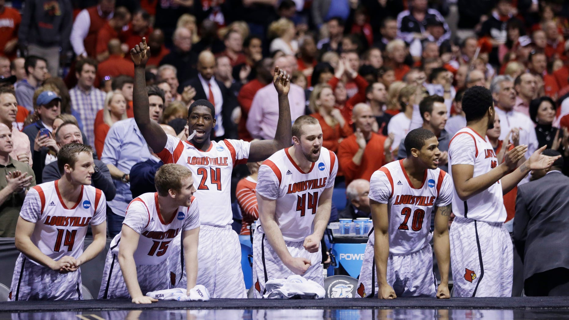 Louisville players react on the bench react in the final minutes of the second half of the Midwest Regional final against Duke in the NCAA college basketball tournament, Sunday, March 31, 2013, in Indianapolis. Louisville won 85-63 to advance to the Final Four. (AP Photo/Darron Cummings)