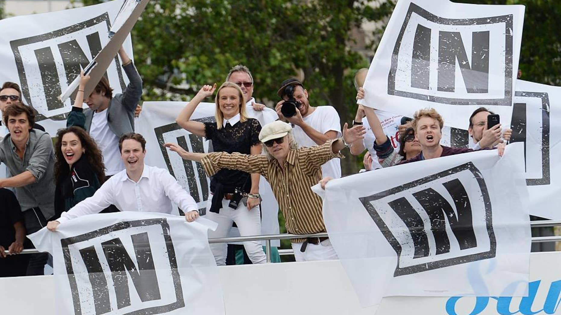 Irish singer Bob Geldof, center, gestures on board a boat taking part in a pro-EU counter demonstration, as a Fishing for Leave pro-Brexit "flotilla" makes its way along the River Thames in London, Wednesday, June 15, 2016. (Stefan Rousseau/PA via AP) UNITED KINGDOM OUT