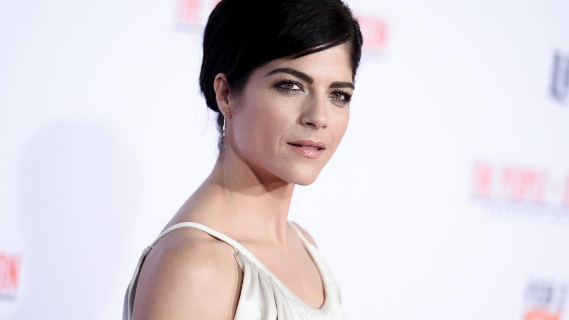 FILE - In this Wednesday, Jan. 27, 2016 file photo, actress Selma Blair attends the LA Premiere of "'American Crime Story: The People v. O.J. Simpson" at Westwood Village Theatre on in Los Angeles. Blair is apologizing for her outburst on a flight. She said in a statement to Vanity Fair on Tuesday, June 21, that she mixed alcohol with medication which caused her to black out and make statements that she regrets on a Monday flight from Cancun to Los Angeles. (Photo by Richard Shotwell/Invision/AP, File)