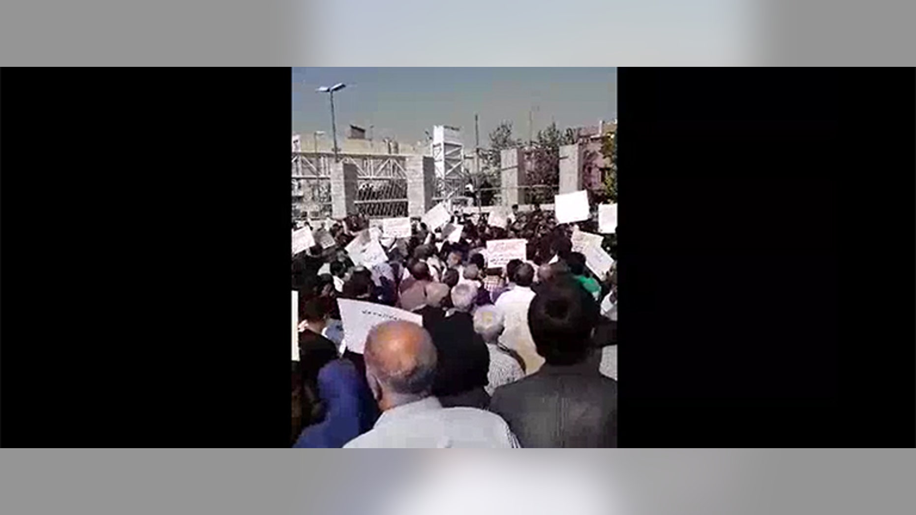 More than 2,000 Iranians protested the country’s parliament because of plundered savings and corrupt policies.