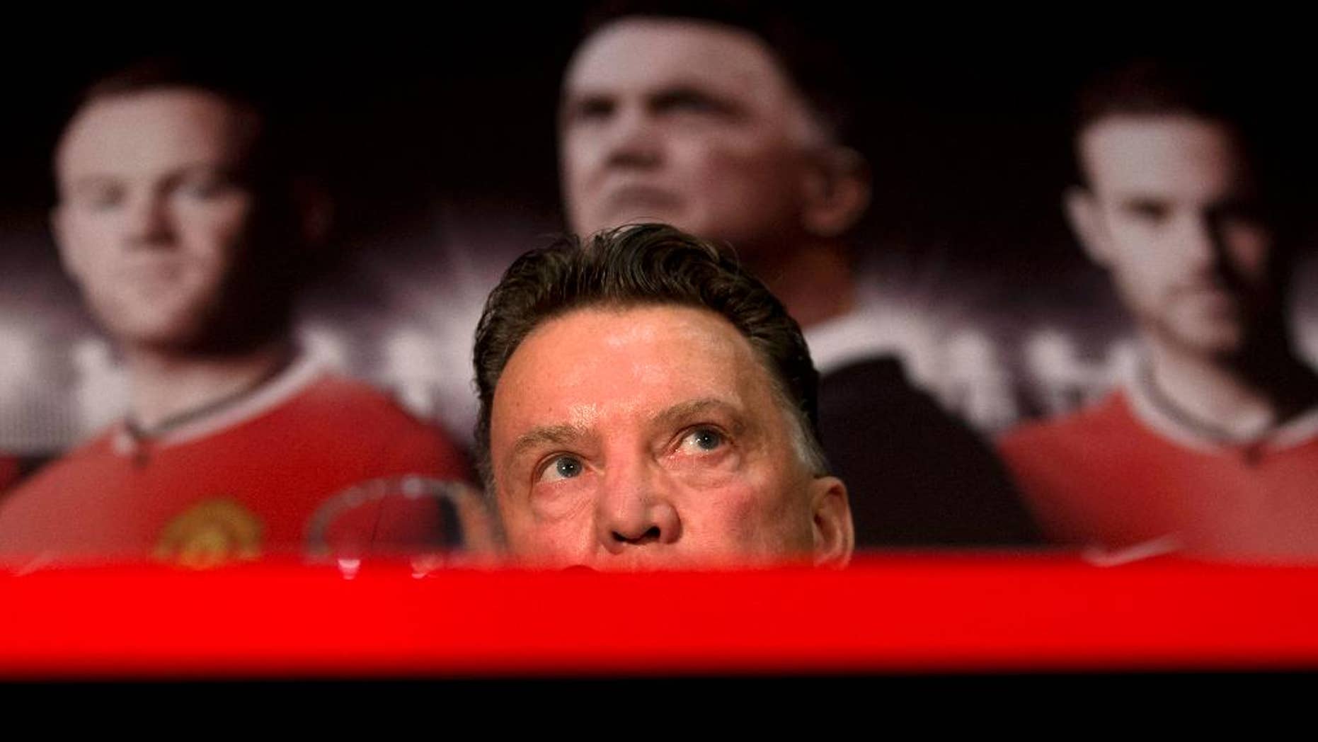 Manchester United's new manager Louis van Gaal speaks during a press conference at Old Trafford Stadium, Manchester, England, Thursday July 17, 2014. The new manager takes over after recently guiding Holland to third place at the 2014 World Cup. (AP Photo/Jon Super)