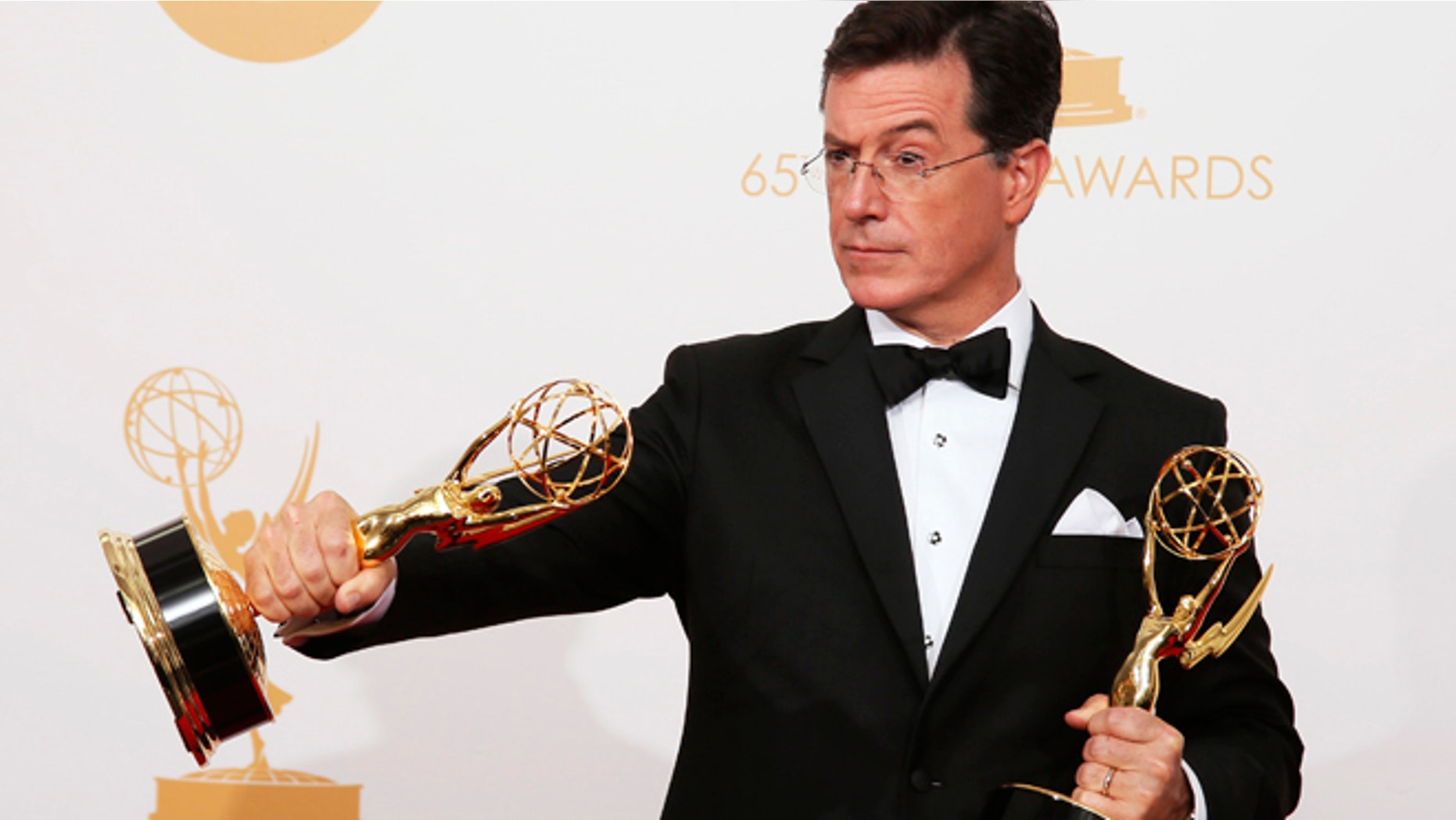 The cast from AMC's series "Breaking Bad" poses backstage with their awards for Outstanding Drama Series
at the 65th Primetime Emmy Awards in Los Angeles September 22, 2013.