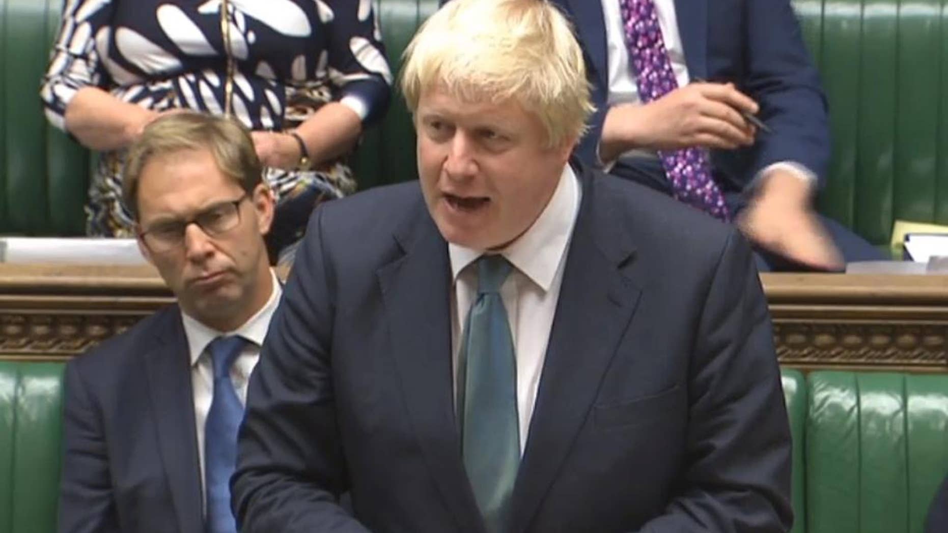 Britain's Foreign Secretary Boris Johnson speaks in the House of Commons, London in this image taken from TV Tuesday Oct. 11, 2016. Johnson said “all the available evidence" points to Russian responsibility for the bombing of an aid convoy in Syria. Johnson told the House of Commons that Russia is “in danger of becoming a pariah nation” because of its actions in Syria. (PA via AP)