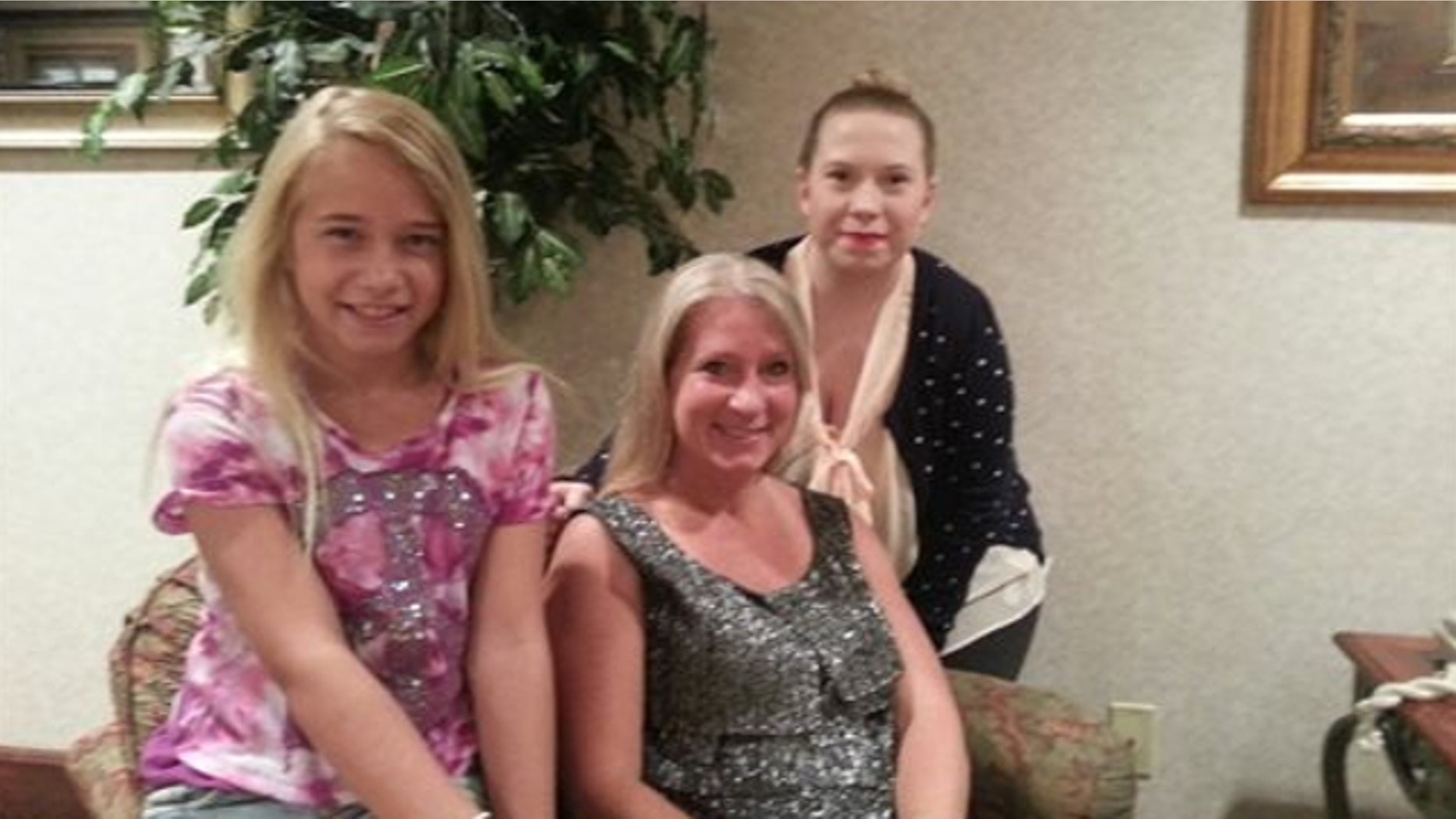 July 1, 2013: This photo provided by the family shows, from left, Jolene, Janet and Gabrielle Dunnabeck at their home in Whitney, Texas.