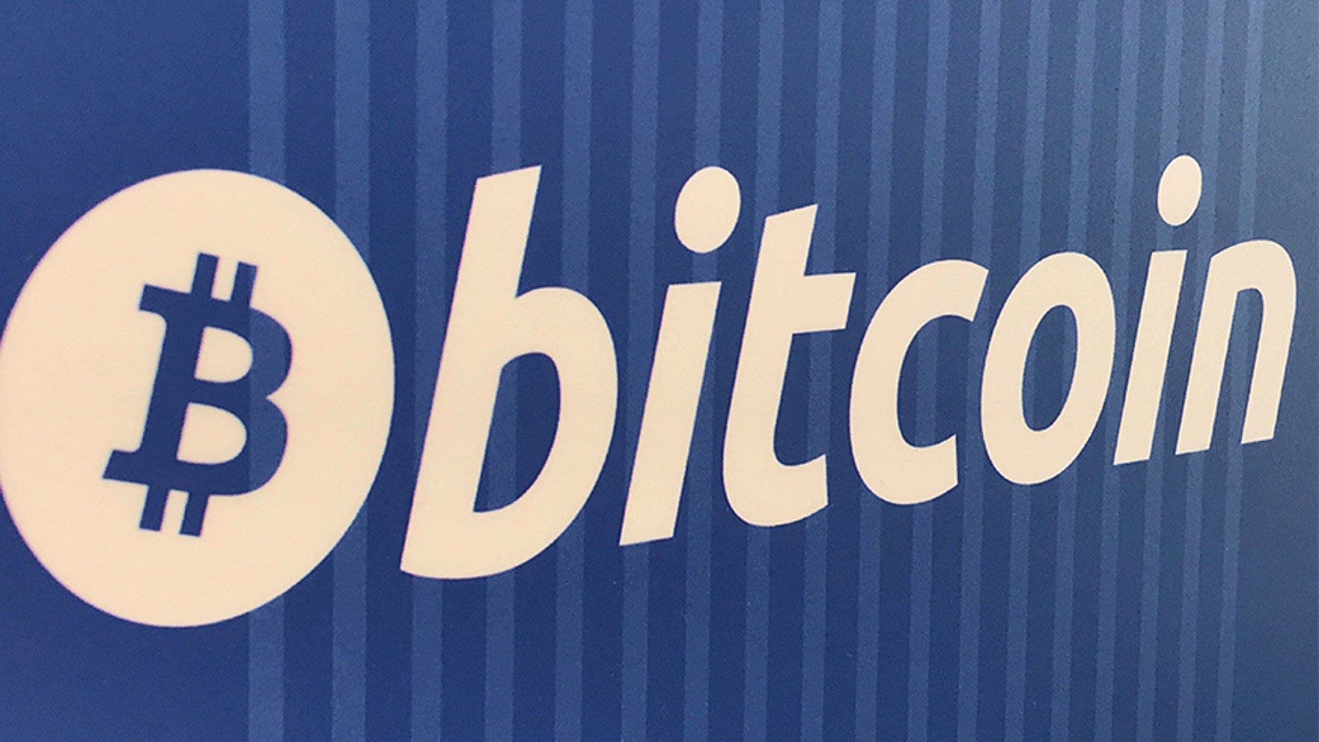 A Bitcoin logo is seen on a cryptocurrency ATM.