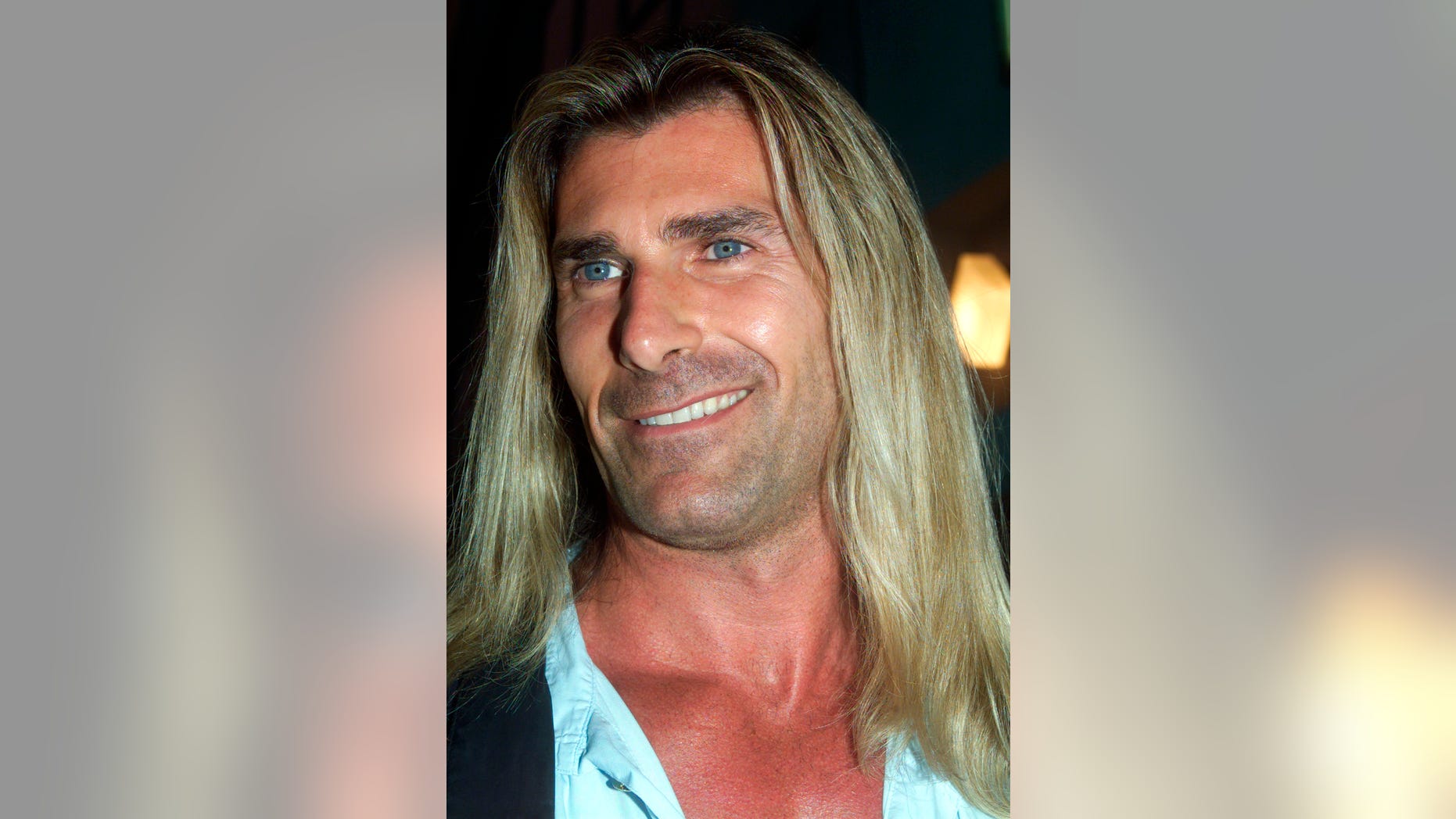 Actor and model Fabio poses as he arrives for the premiere of Rodney Dangerfield's the new film " My 5 Wives" August 28, 2000 in Santa Monica, California. The comedy film stars Dangerfield as a millionaire who tries to buy land in Utah and ends up with five wives. The film, also features Fabio and opens September 8 in the United States.RMP - RTR7ORB