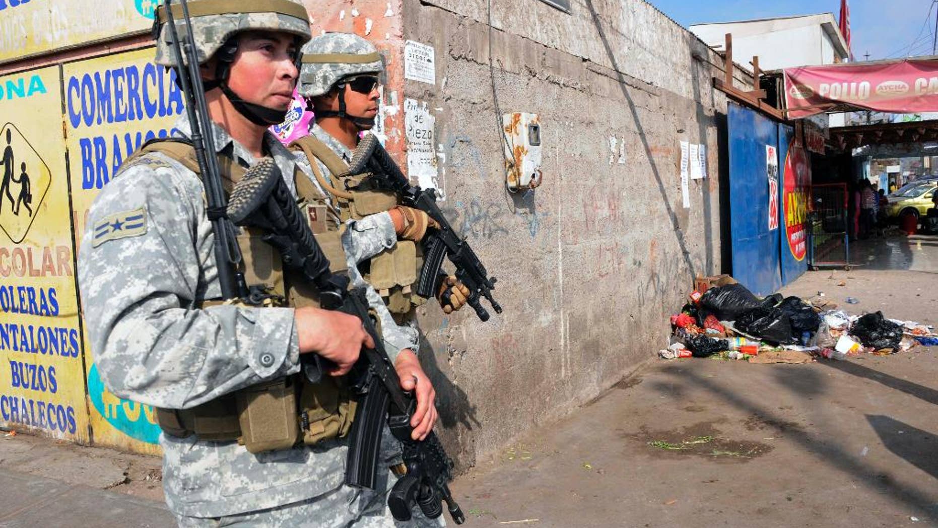 Soldiers patrol after earthquakes affected Alto Hospicio, Chile, Thursday, April 3, 2014. Chile is one of the world's most earthquake-prone countries, and tsunamis are a particular danger because the fault zone lies just offshore, where the Nazca tectonic plate plunges beneath the South American plate. A magnitude-8.2 earthquake hit Chile's Pacific coast late Tuesday. (AP Photo/Cristian Vivero)