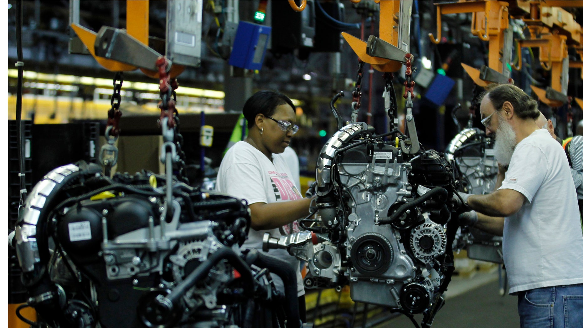 June 13, 2012: Workers assemble the new 2013 Ford Escape on the production line at the company's newly transformed Louisville Assembly Plant in Louisville, Ky.