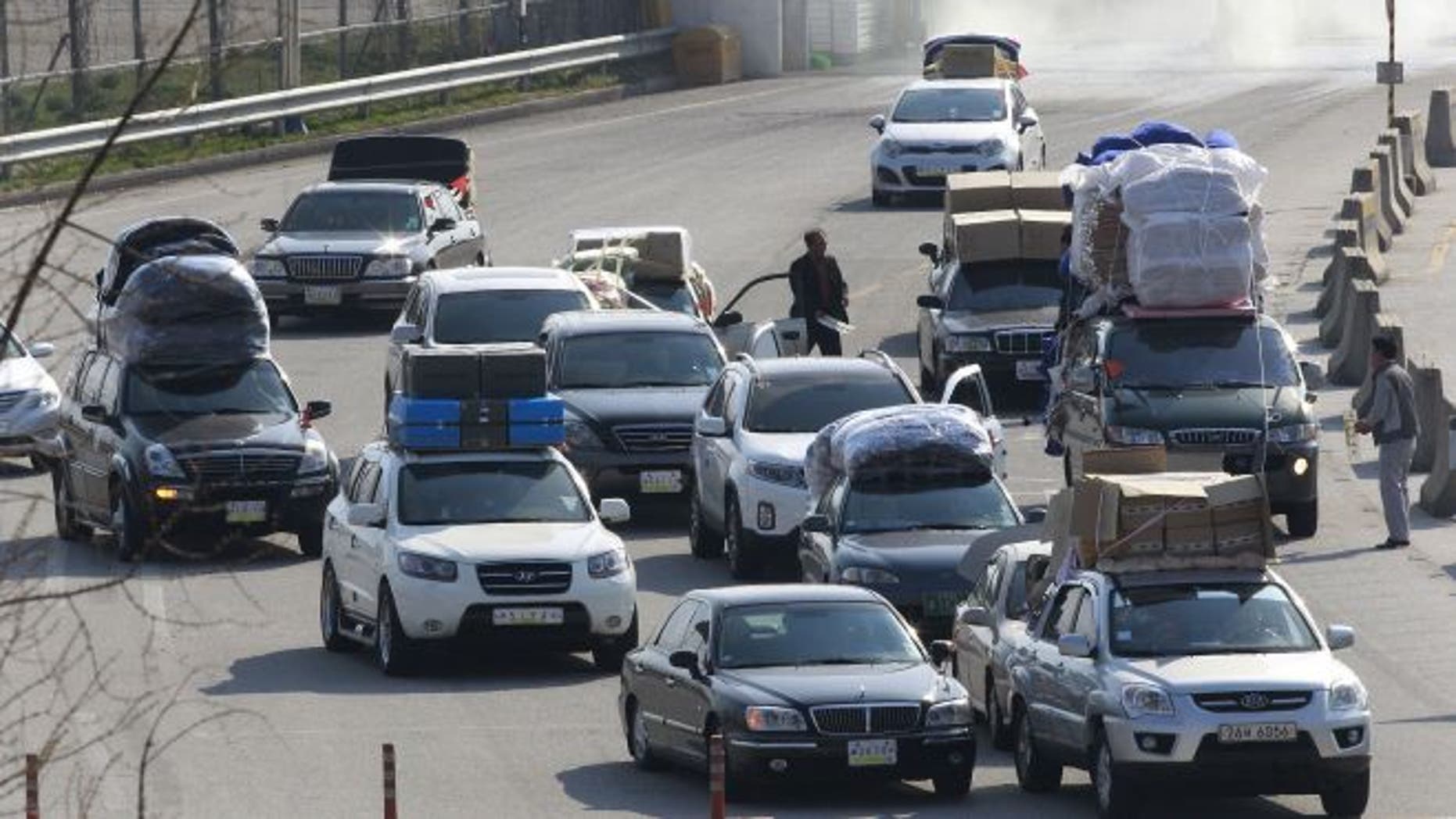 April 27, 2013: South Korean vehicles carrying products from North Korea's Kaesong industrial complex arrive at the customs, immigration and quarantine office near the border village of Panmunjom in Paju, South Korea.