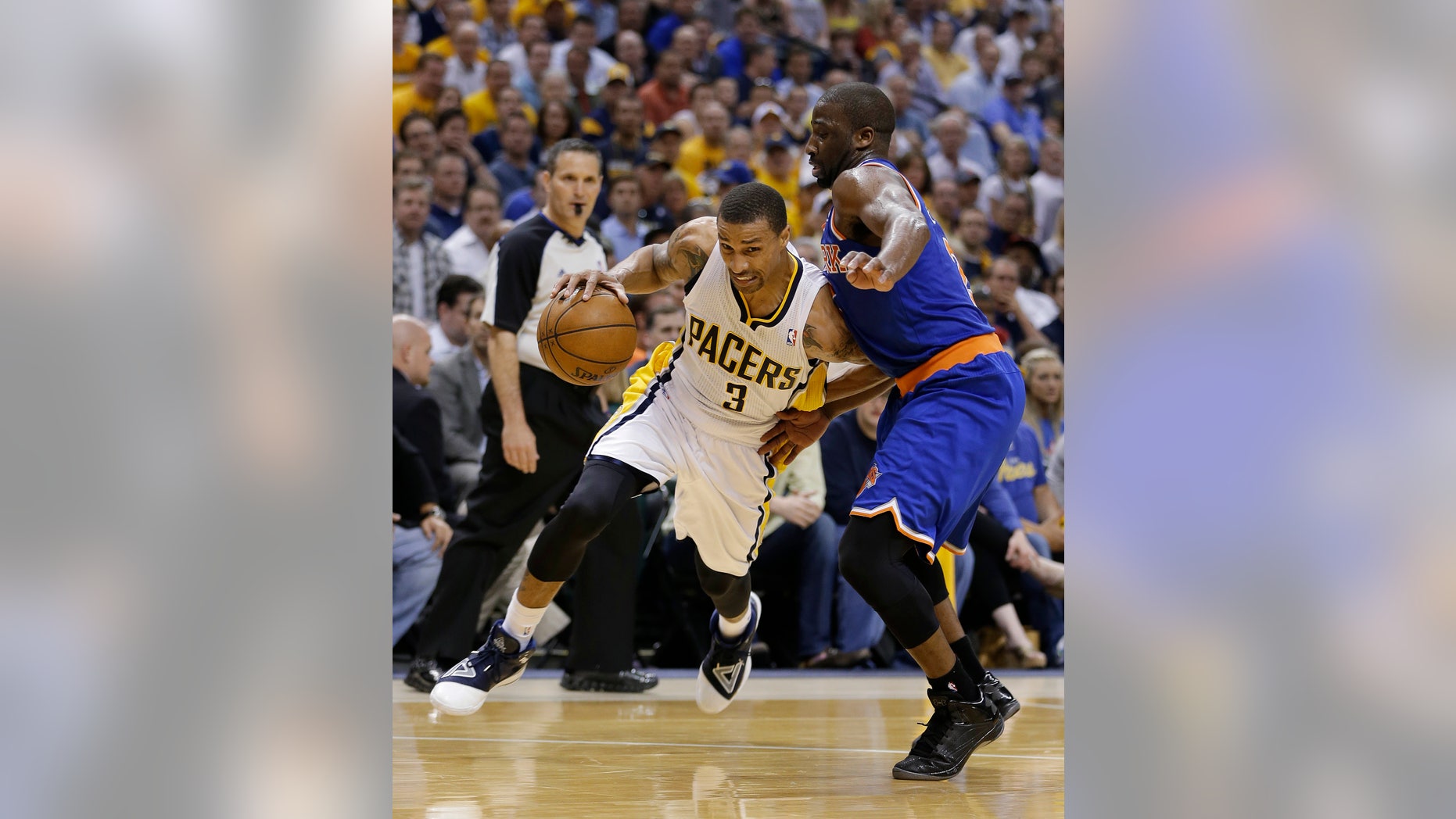 Indiana Pacers' George Hill goes to the basket against New York Knicks' Raymond Felton during the second half of Game 4 of an Eastern Conference semifinal NBA basketball playoff series, on Tuesday, May 14, 2013, in Indianapolis. Indiana defeated New York 93-82. (AP Photo/Darron Cummings)