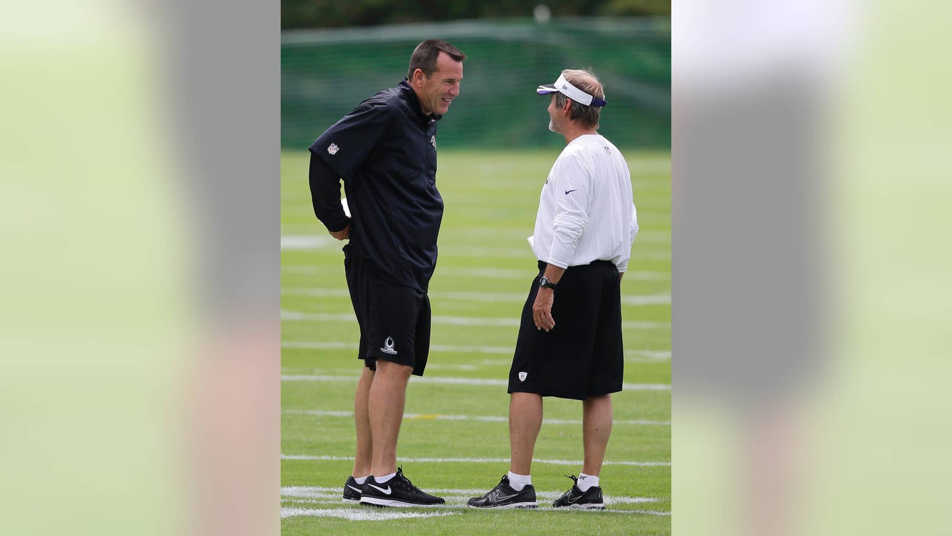 Baltimore Ravens offensive coordinator Gary Kubiak, left, chats with senior offensive assistant Craig Ver Steeg during NFL football training camp, Tuesday, July 22, 2014, at the team's practice facility in Owings Mills, Md. (AP Photo)