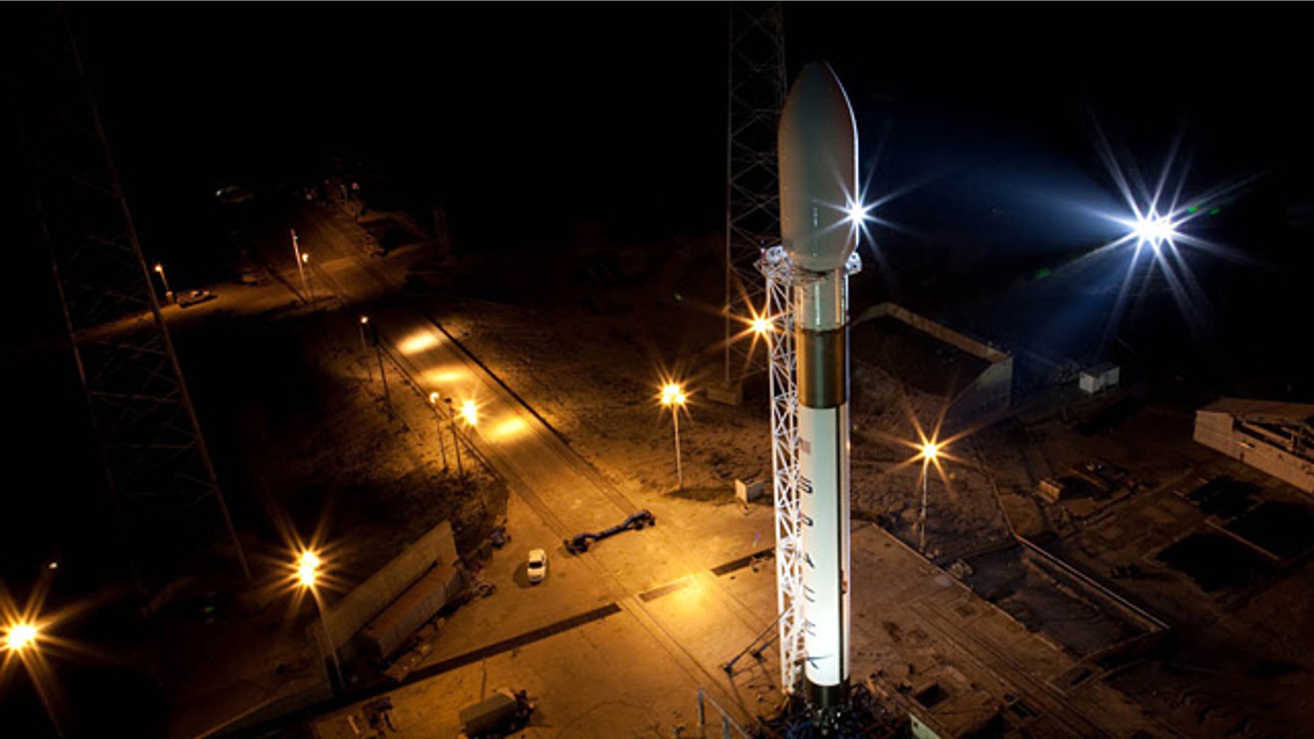 SpaceX's first Falcon 9 rocket, designed to launch the Dragon spacecraft, stands vertical atop its Space Launch Complex 40 pad at the Cape Canaveral Air Force Station in Jan. 2009.