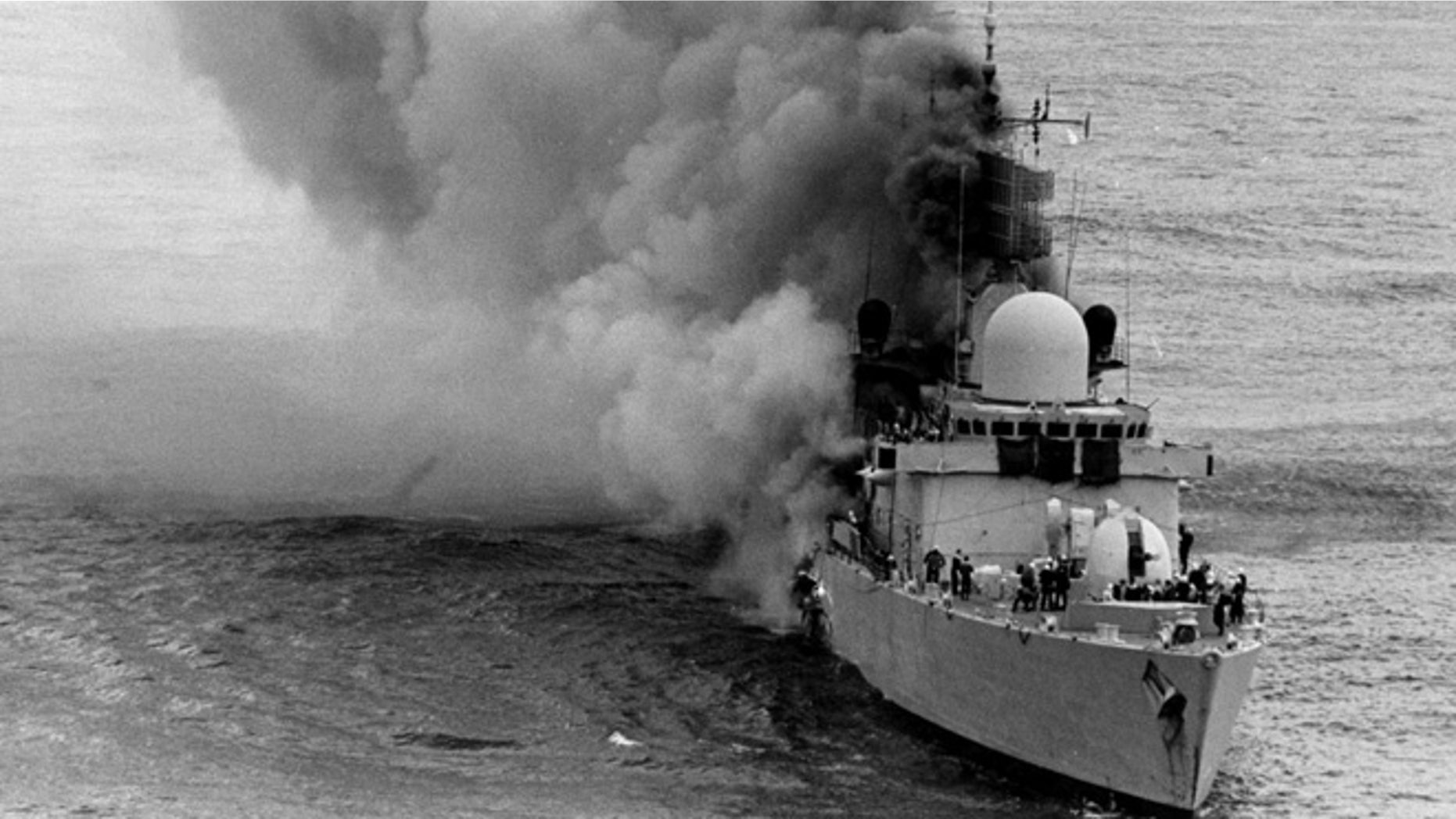 Apr. 20, 1982: British Royal Navy HMS Sheffield frigate, damaged from Argentine Exocet missile, before sinking, during The Falkland Islands war. (AP)