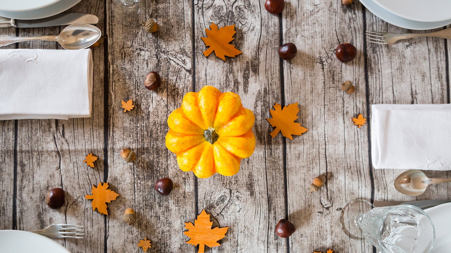 Autumnal laid table with yellow pumpkin