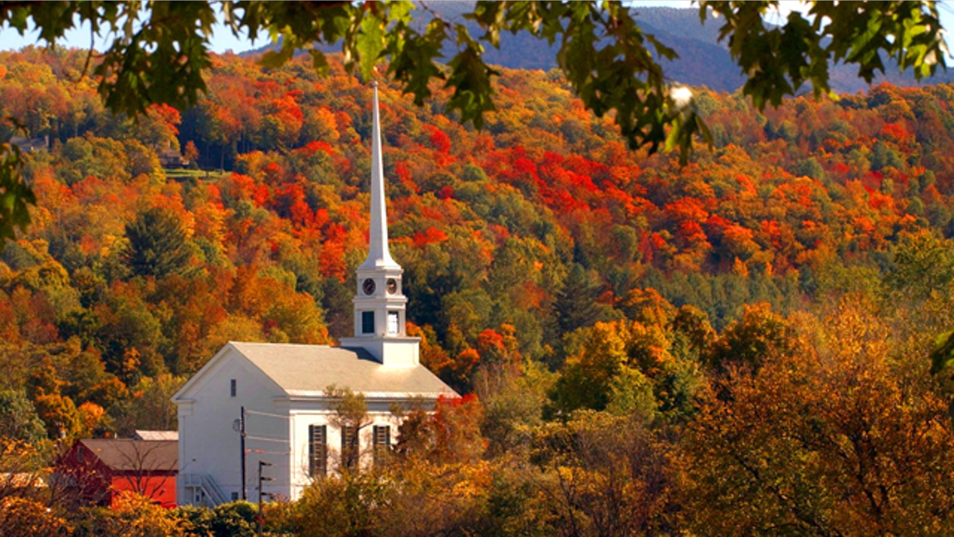 The early fall foliage frames the Stowe Community Church in Stowe, Vt., Tuesday, Oct. 5, 2004.