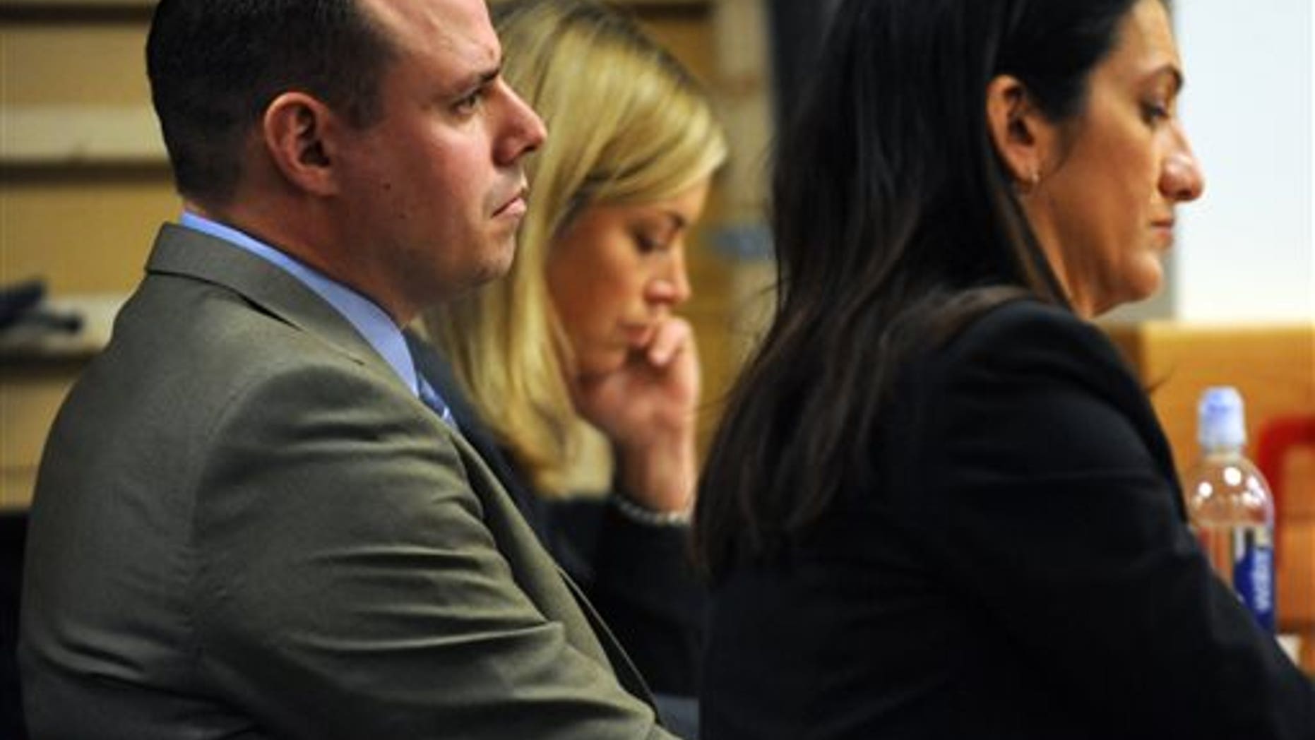 Tom Fallis watches opening statements on March 16.