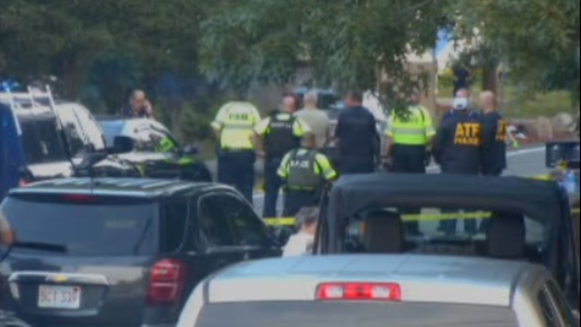 Two Massachusetts police officers were shot on Friday while investigating a “disturbance,” authorities said.