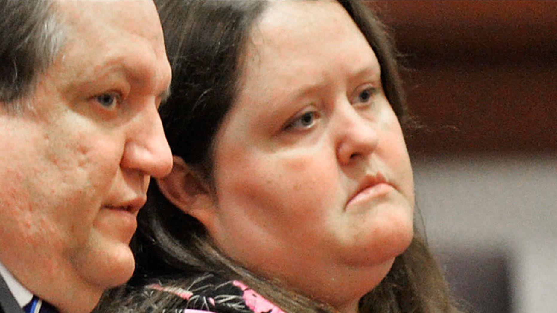 April 15, 2014: In this photo, Rachael Michelle Rapraeger, right, sits with her attorney, Floyd Buford, during a sentencing hearing.