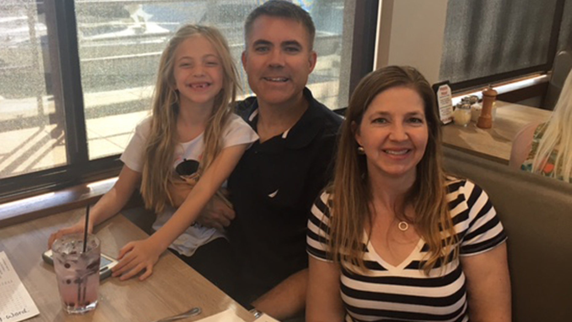 Christian Heller, flanked by daughter Audrey and wife Rachel, is grateful for Audrey's piano lessons provided by Our Military Kids.