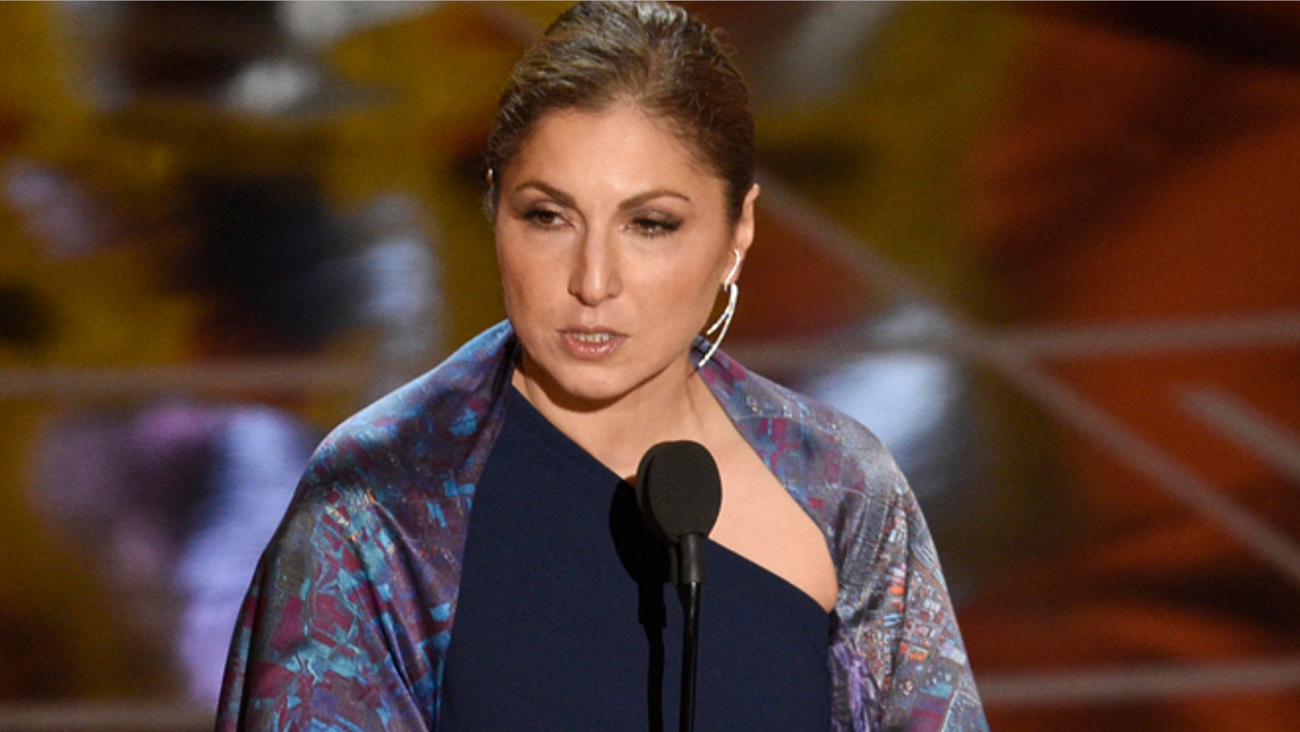 Anousheh Ansari accepts the award for best foreign language film for "The Salesman" on behalf of Asghar Farhadi at the Oscars on Sunday, Feb. 26, 2017, at the Dolby Theatre in Los Angeles. (Photo by Chris Pizzello/Invision/AP)