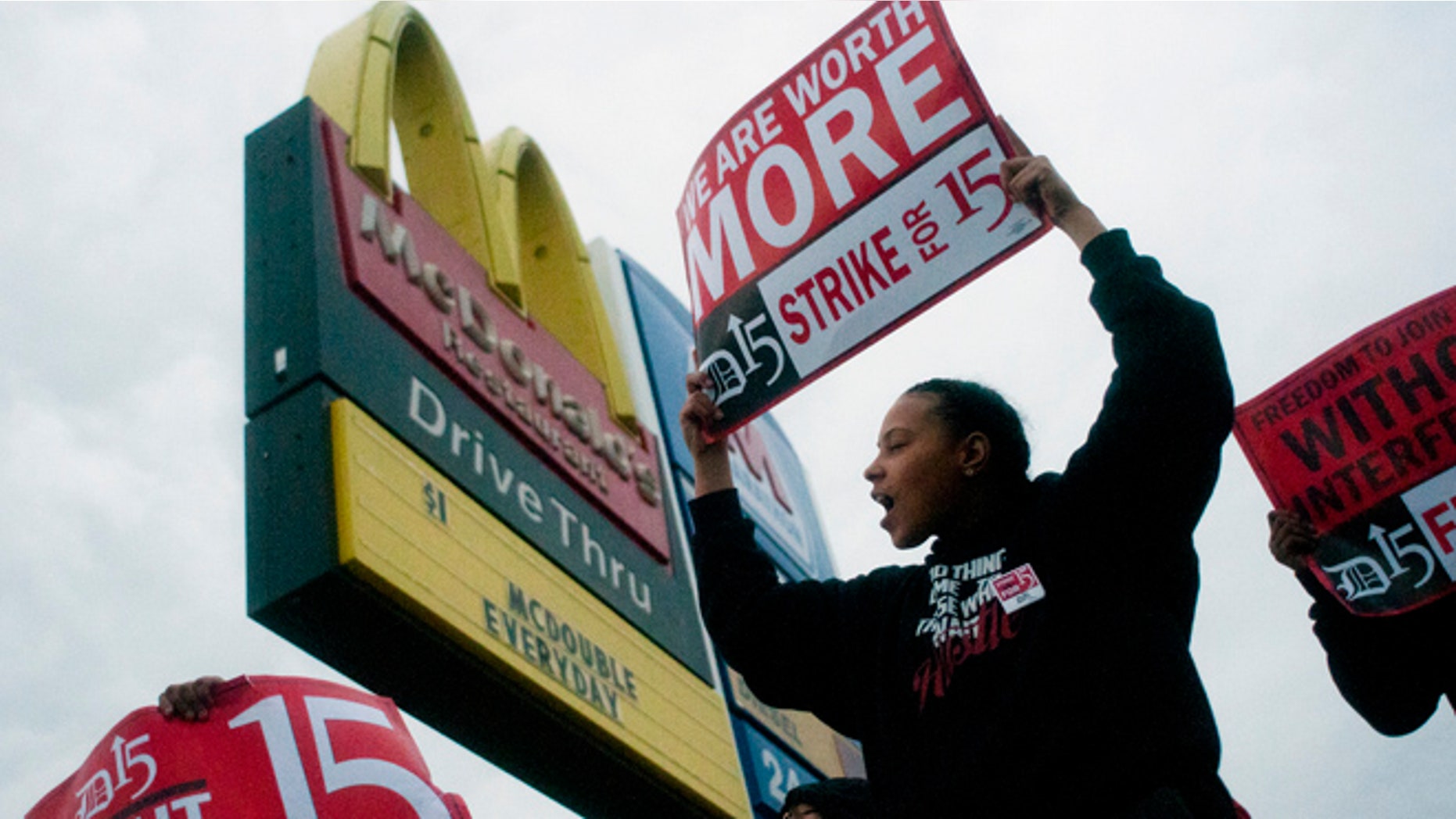July 31, 2013: Fast-food worker Michelle Osborn, 23, of Flint, Mich. shouts out chants as she and a few dozen others strike outside of a McDonald's restaurant in Flint. A few thousand fast-food workers in seven cities took to the streets demanding better pay, the right to unionize and a more than doubling of the federal minimum hourly wage from $7.25 to $15.