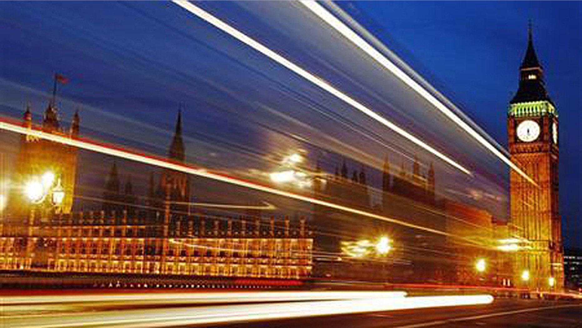 Light trails made by a passing bus illuminate the night sky in front of Britain's Houses of Parliament in London, February 4, 2010.
