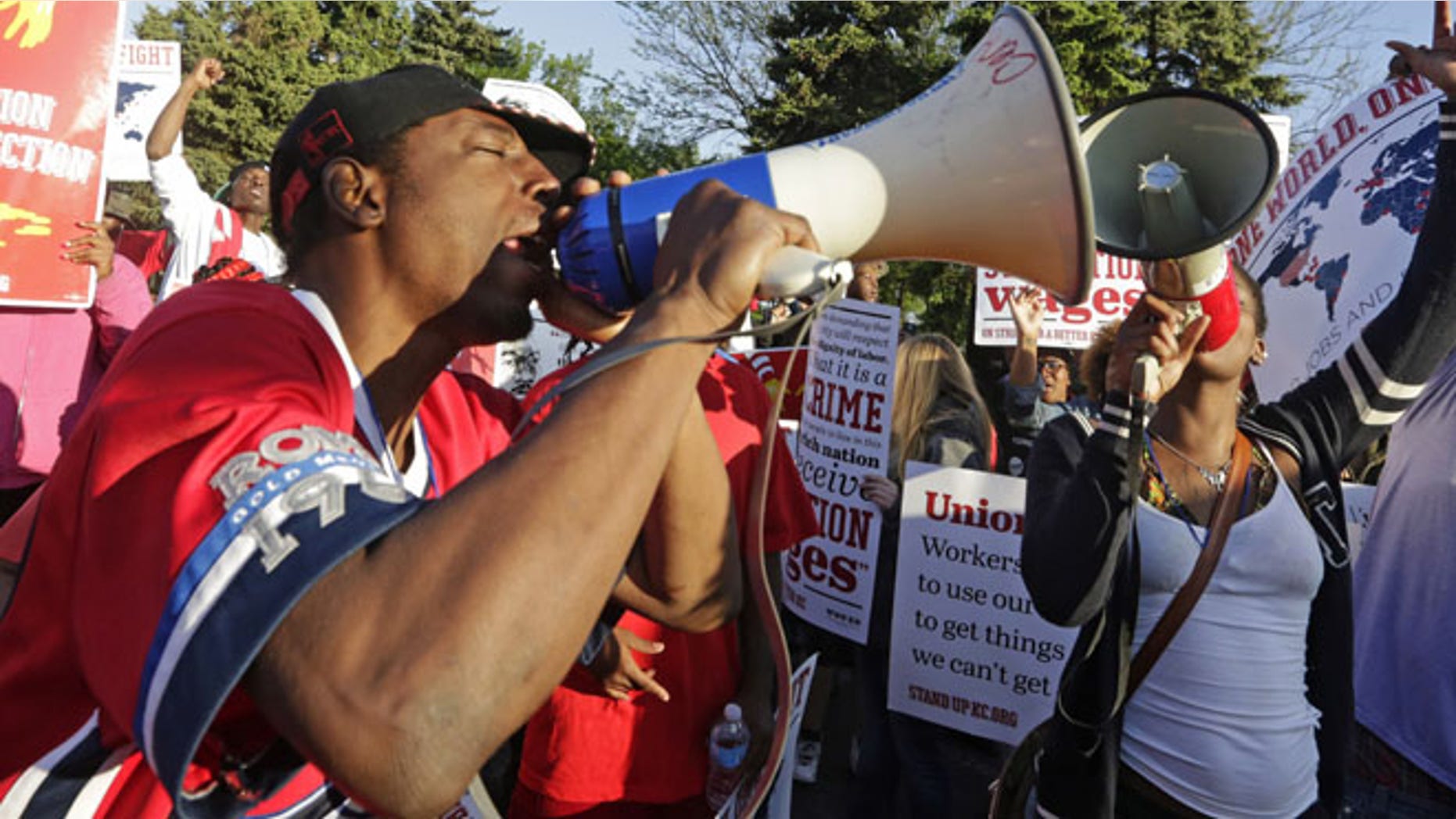 May 22, 2014: Protesters gather outside of the McDonald's Corporation headquarters in Oak Brook, Ill., the annual shareholders meeting demonstrating for higher wages and the right to unionize. (AP)