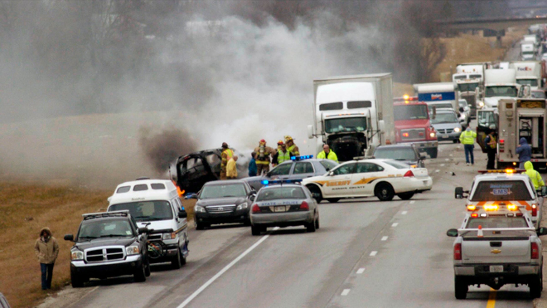 March 2, 2013: Emergency personnel work at the scene of a multi-vehicle wreck on Interstate 65 near the 82 mile marker north of Sonora, Ky.