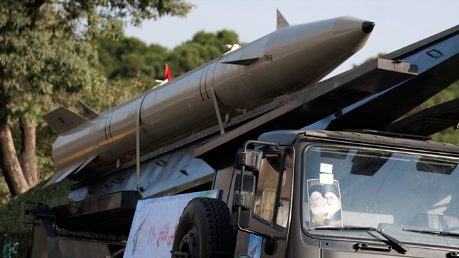 Iran unveils upgraded missile as Israel turns to talk of attack plan