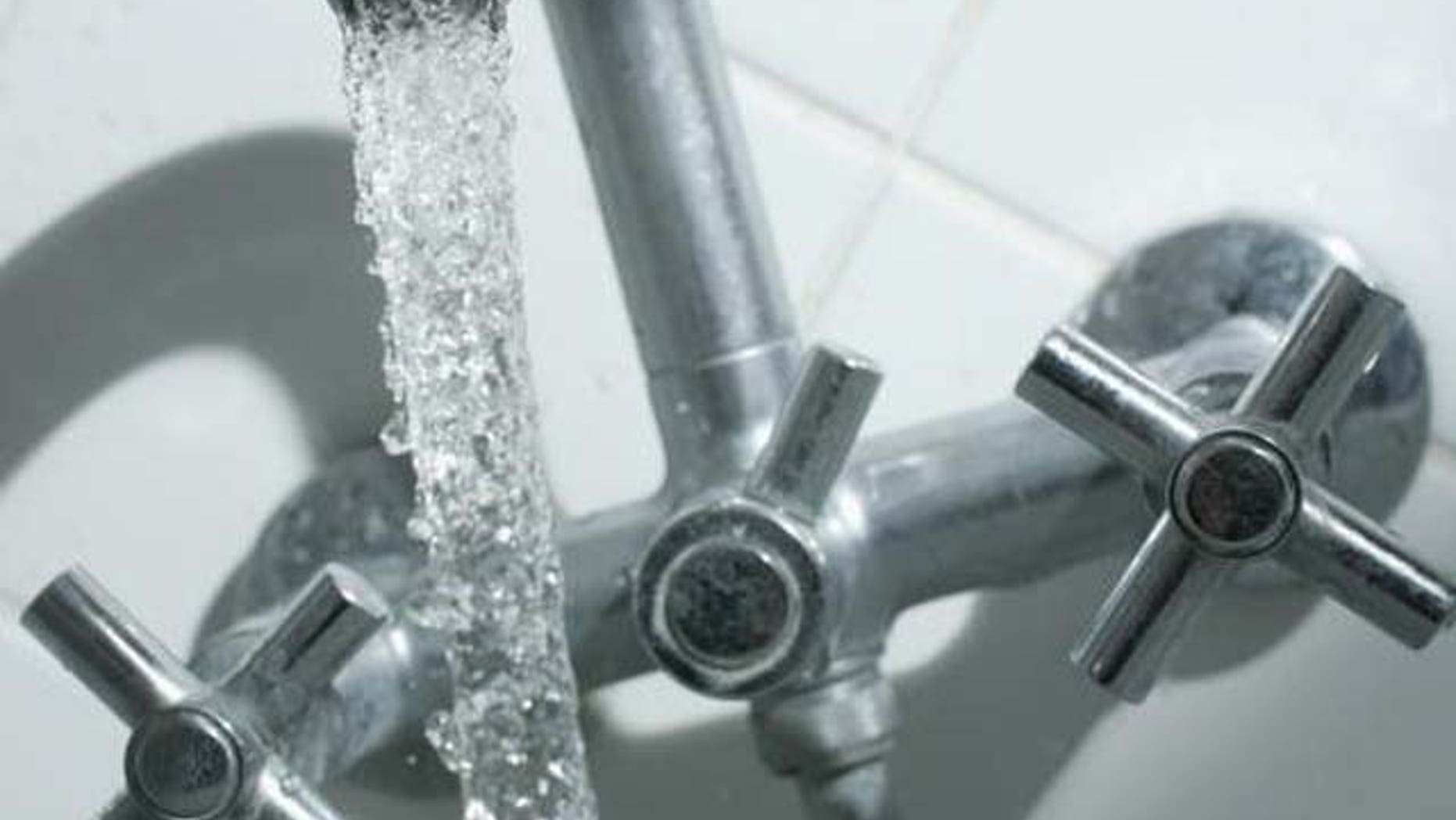 BERLIN - JANUARY 12: Water flows from a bathroom tap January 12, 2007 in Berlin, Germany. (Photo Illustration by Sean Gallup/Getty Images)