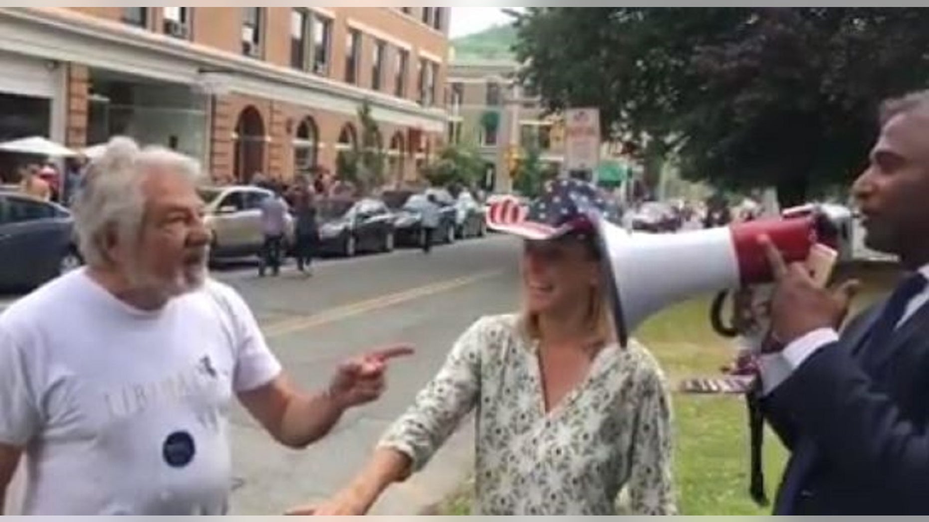 An Elizabeth Warren supporter, identified as Paul Solovay, 74, left, was arrested and charged with assault after he allegedly struck Senate candidate Shiva Ayyadurai, right, authorities said.
