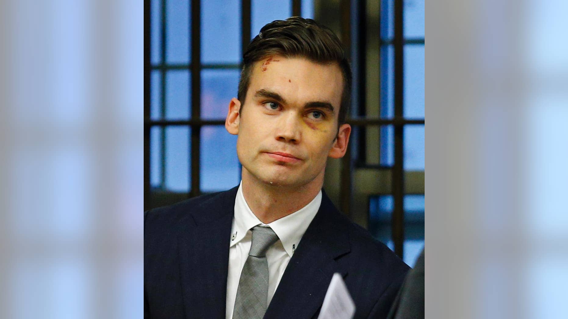 Cameron Shenk, 26, appears at his arraignment at East Boston Municipal Court, Wednesday, Nov. 26, 2014, on charges that include attempted murder, assault and battery on a person over 60, and lewd and lascivious conduct. Police say the 26-year-old Shenk fell through the ceiling of a women's bathroom at Boston's Logan airport at about noon Saturday. He had allegedly sneaked into the bathroom, undressed inside a stall and climbed into the ceiling crawl space. Police say he then fled the bathroom and assaulted an 84-year-old man. He has been ordered held without bail pending a hearing next week. (AP Photo/The Boston Herald, Nancy Lane, Pool)