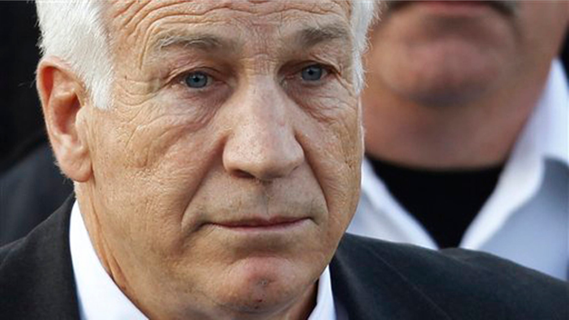December 13, 2011: Jerry Sandusky, the former Penn State assistant football coach charged with sexually abusing boys, leaves the Centre County Courthouse in Bellefonte, Pa.
