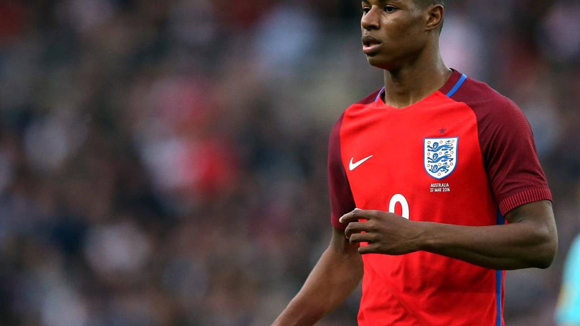 FILE - In this Friday, May 27, 2016 file photo, England's Marcus Rashford runs during the International friendly soccer match between England and Australia at the Stadium of Light, Sunderland, England. Marcus Rashford is going to the European Championship with England, barely three months after the 18-year-old striker made his senior debut with Manchester United. Rashford scored three minutes into his England debut in Friday’s 2-1 win over Australia and he made the cut on Tuesday, May 31 for the final 23-man Euro 2016 squad. (AP Photo/Scott Heppell, file)
