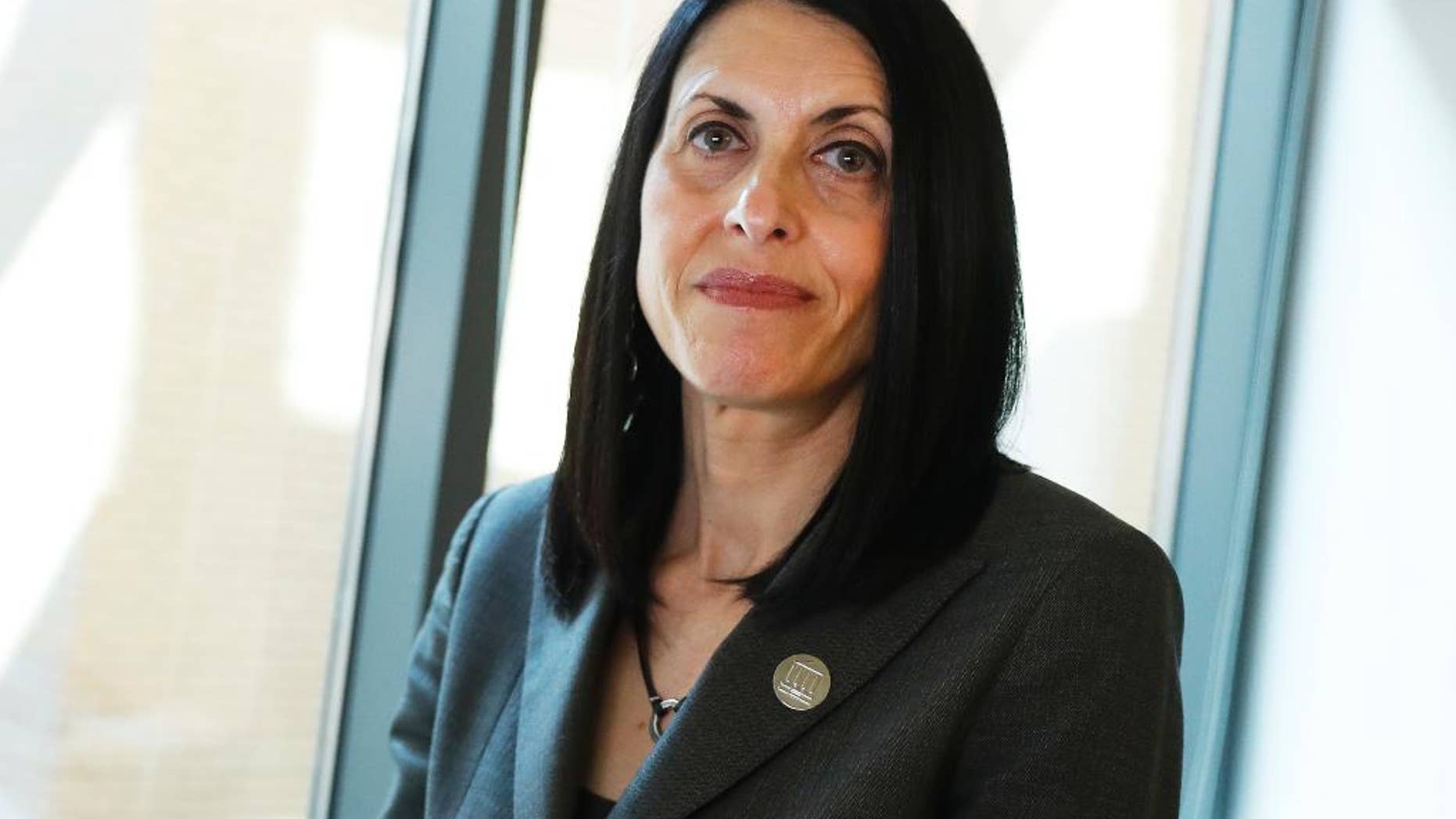 In this Wednesday, March 29, 2017, photo, Adele Kimmel, senior attorney with the law firm Public Justice and head of its anti-bullying campaign, poses for a photograph at their national headquarters in Washington. “The notion of holding schools accountable and making sure they make changes to address sexual assault is very important to victims,” said Kimmel. (AP Photo/Carolyn Kaster)