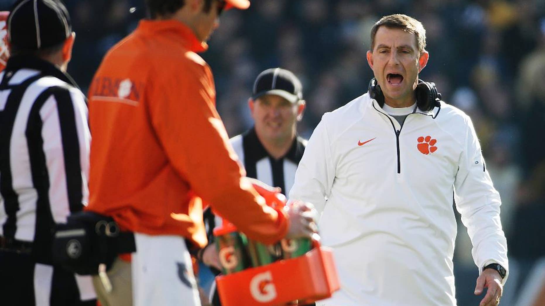 Clemson head coach Dabo Swinney argues a call with an official in the fourth quarter of an NCAA college football game against Georgia Tech, Saturday, Nov. 15, 2014, in Atlanta. Georgia Tech won 28-6. (AP Photo/David Goldman)